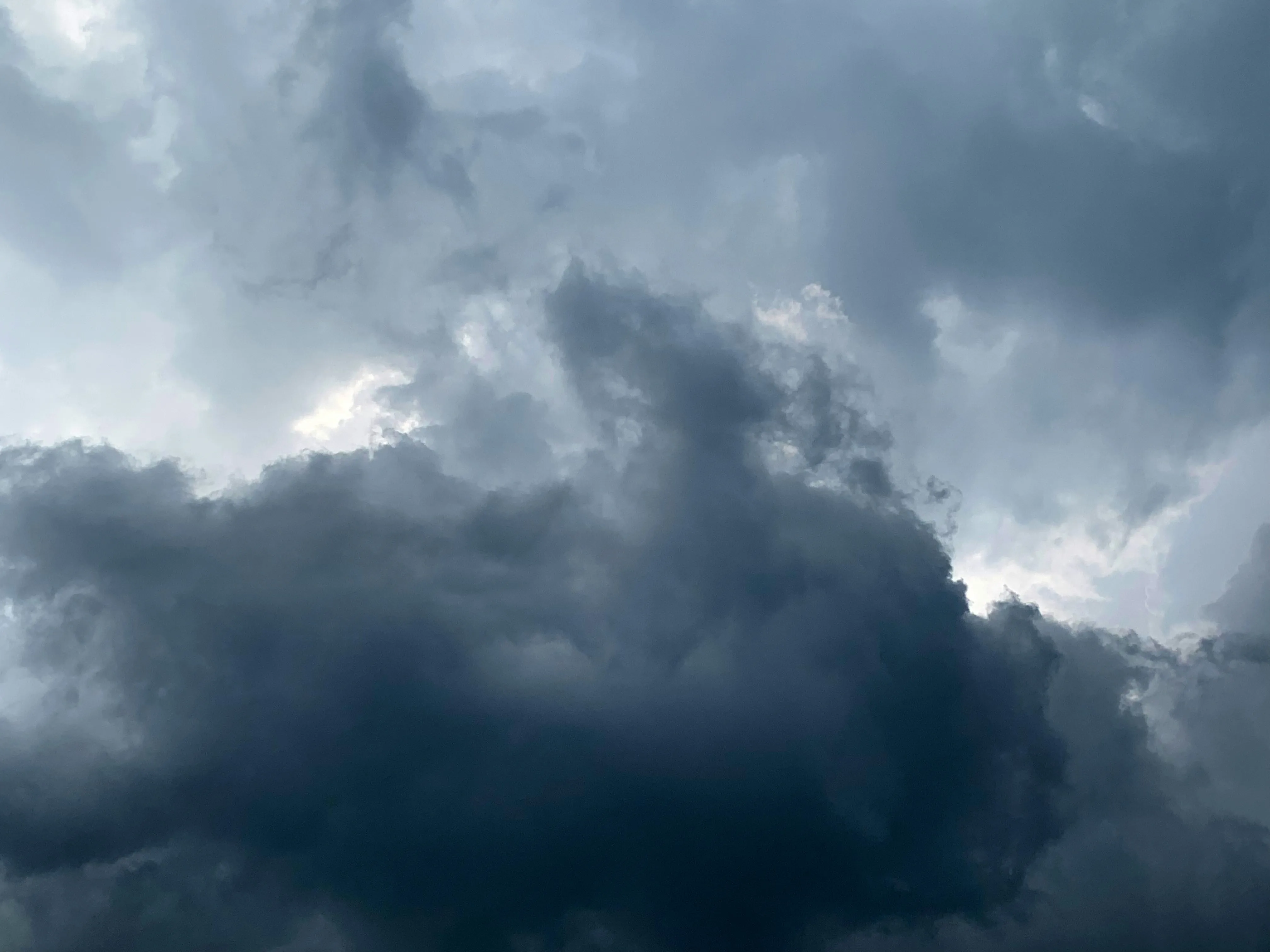 Dark Rain Clouds Forming Before a Thunderstorm Wallpaper