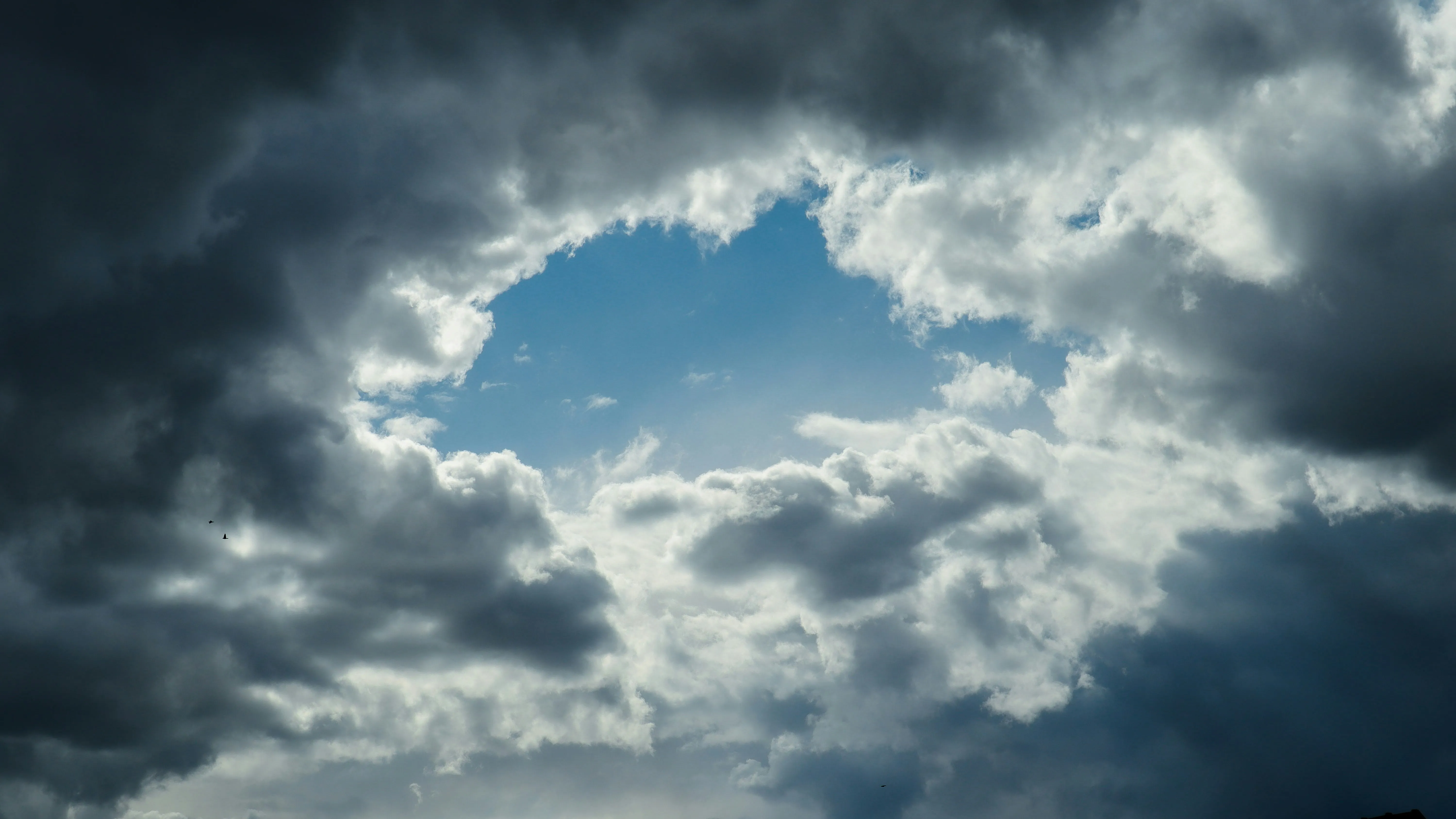 Dark Rain Clouds Rolling in Over Quiet Countryside Image