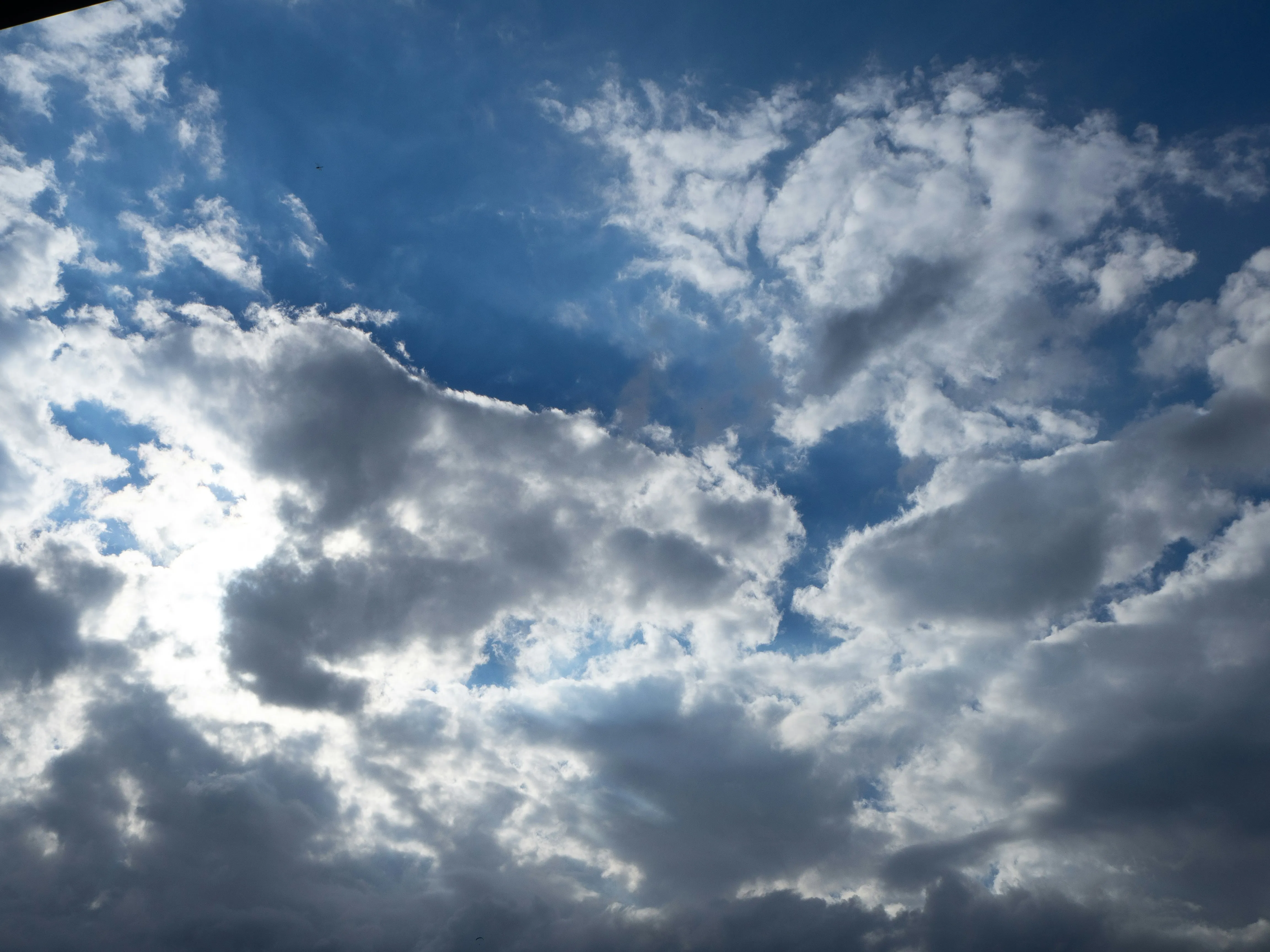 Dark Storm Clouds Creating Intense Contrast in Blue Sky