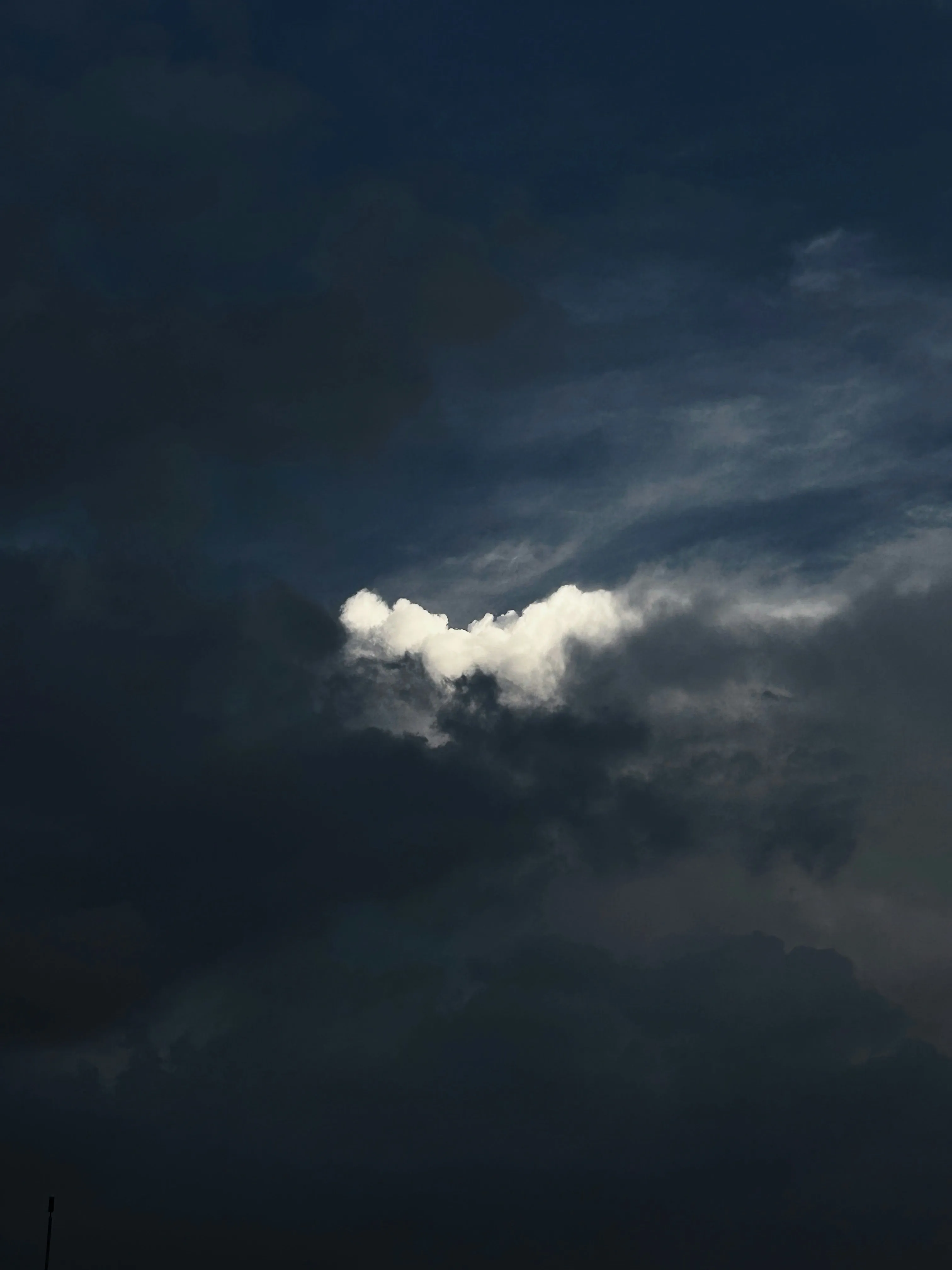 Dark Storm Clouds Gathering with Small Light Break Wallpaper