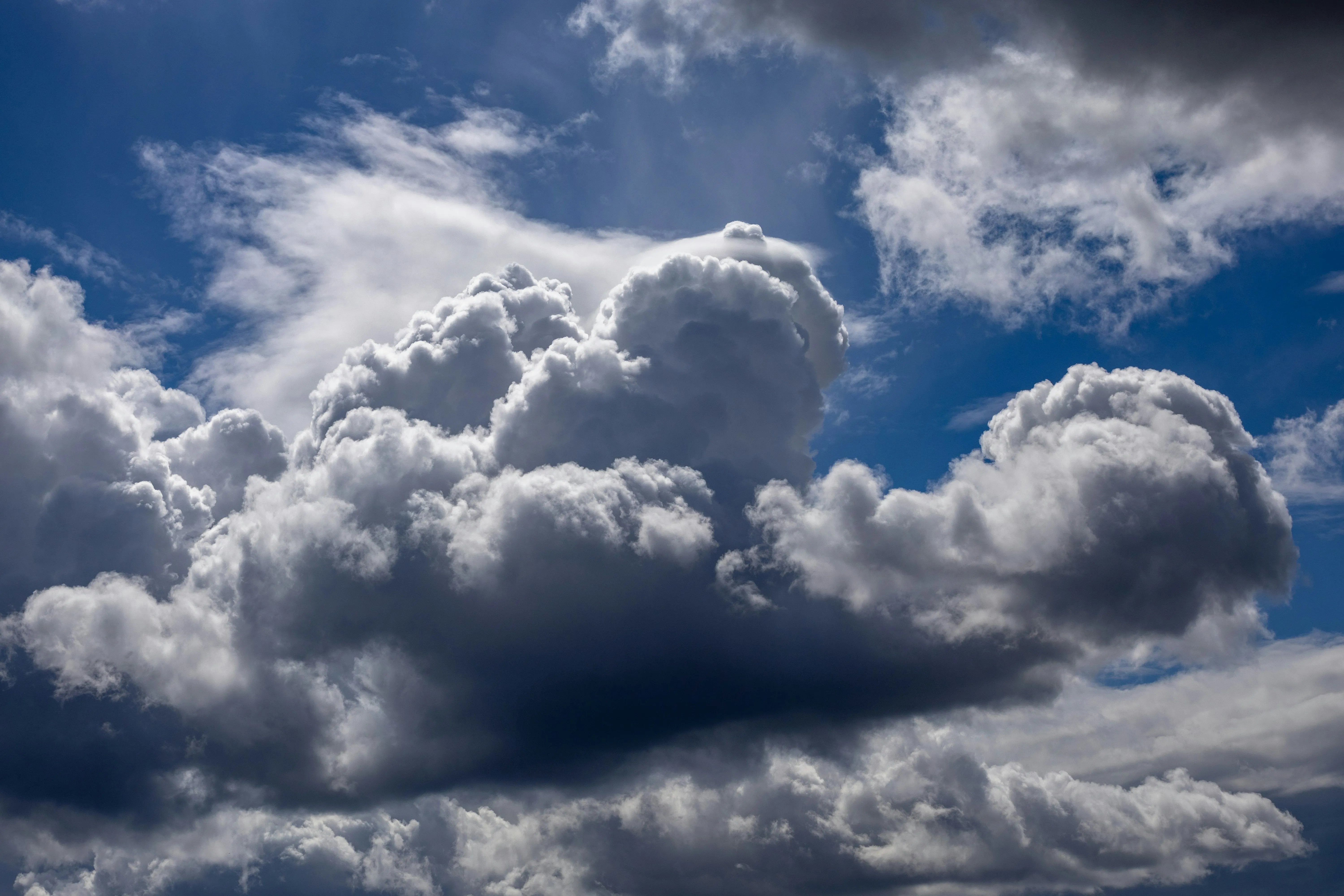 Dark Storm Clouds Moving Across Sky Over Landscape