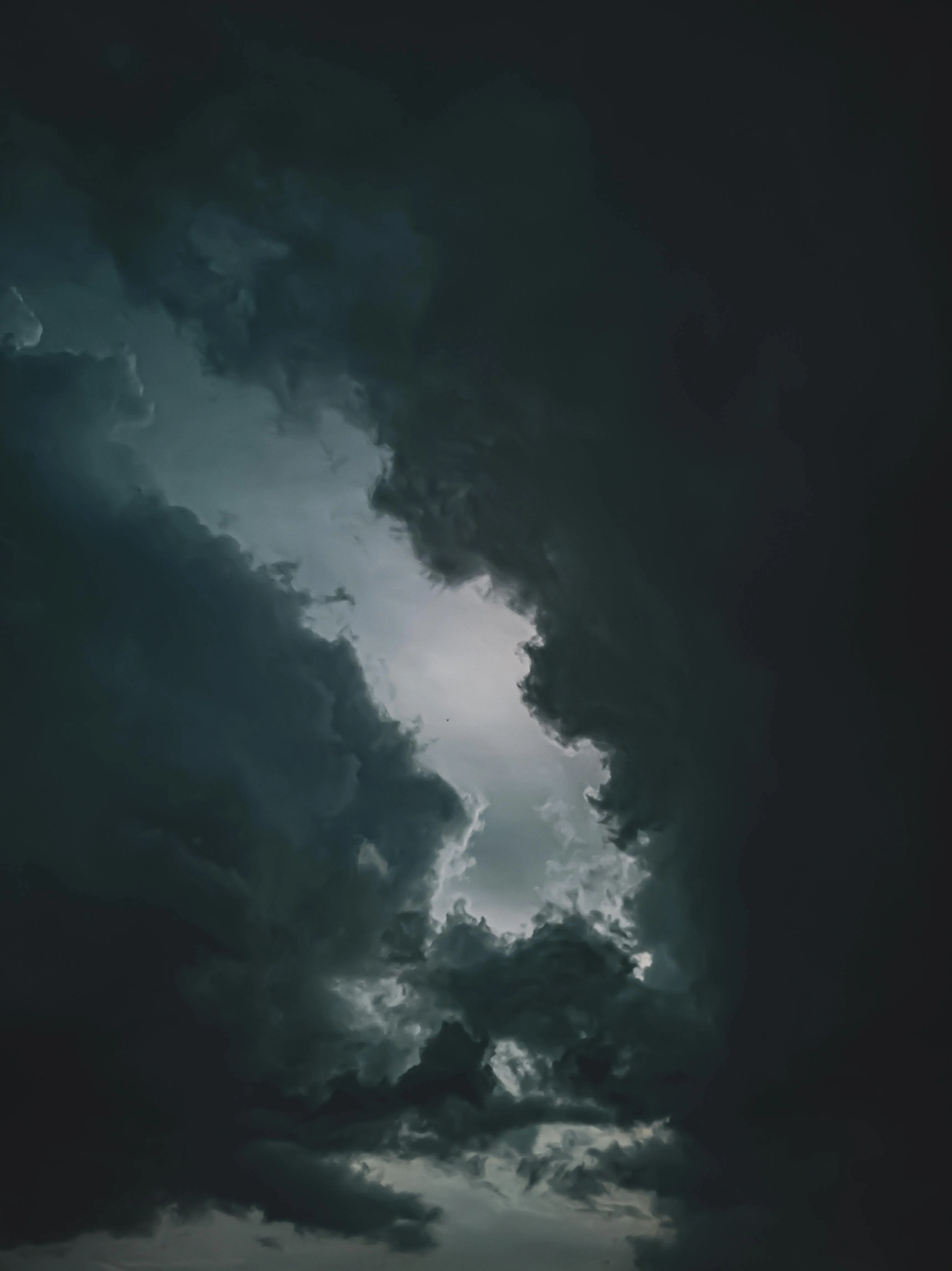 Dark Storm Clouds Rising in a Dramatic Sky Scene Wallpaper