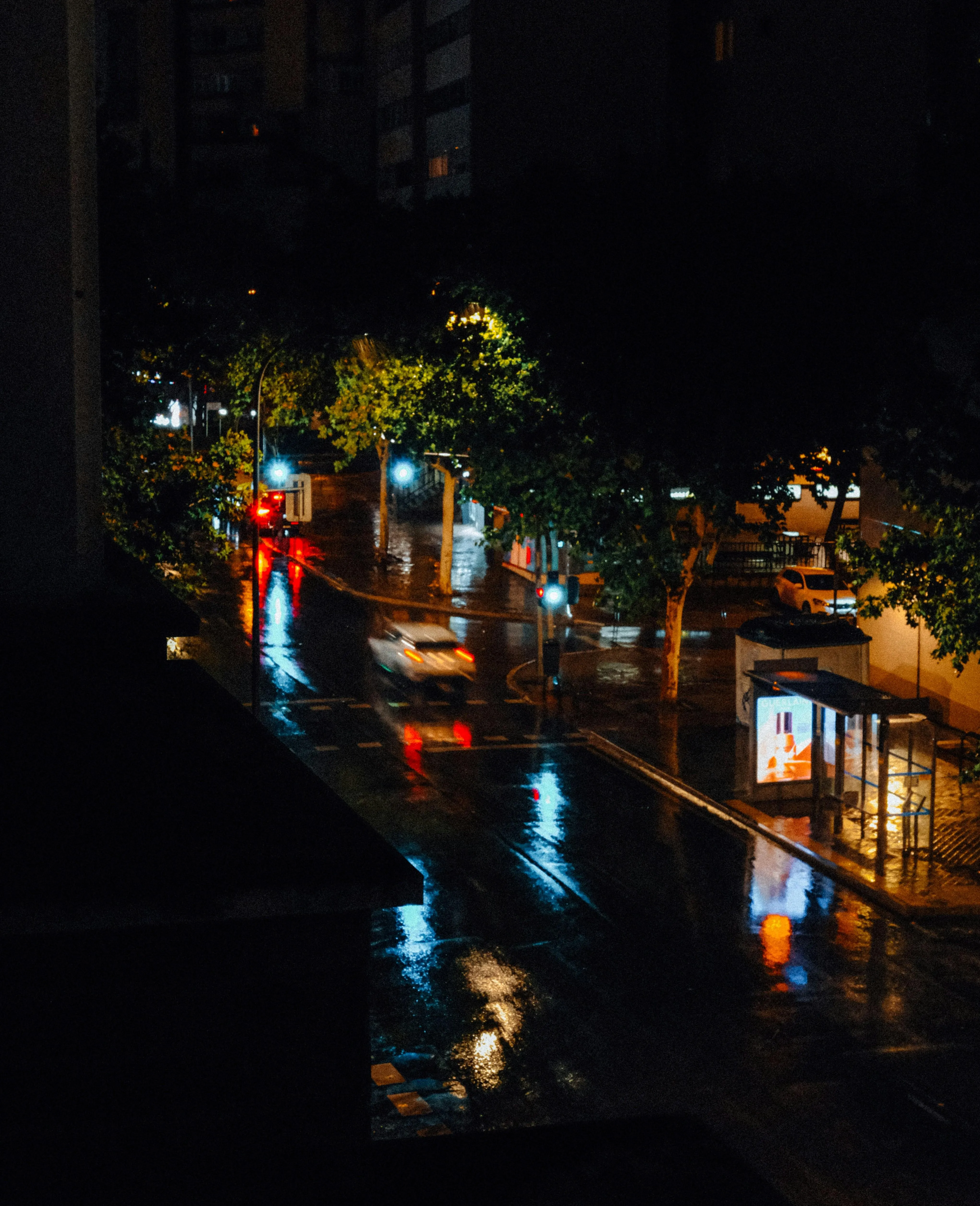 Dark Street Scene in Heavy Rain and Night Lights Wallpaper