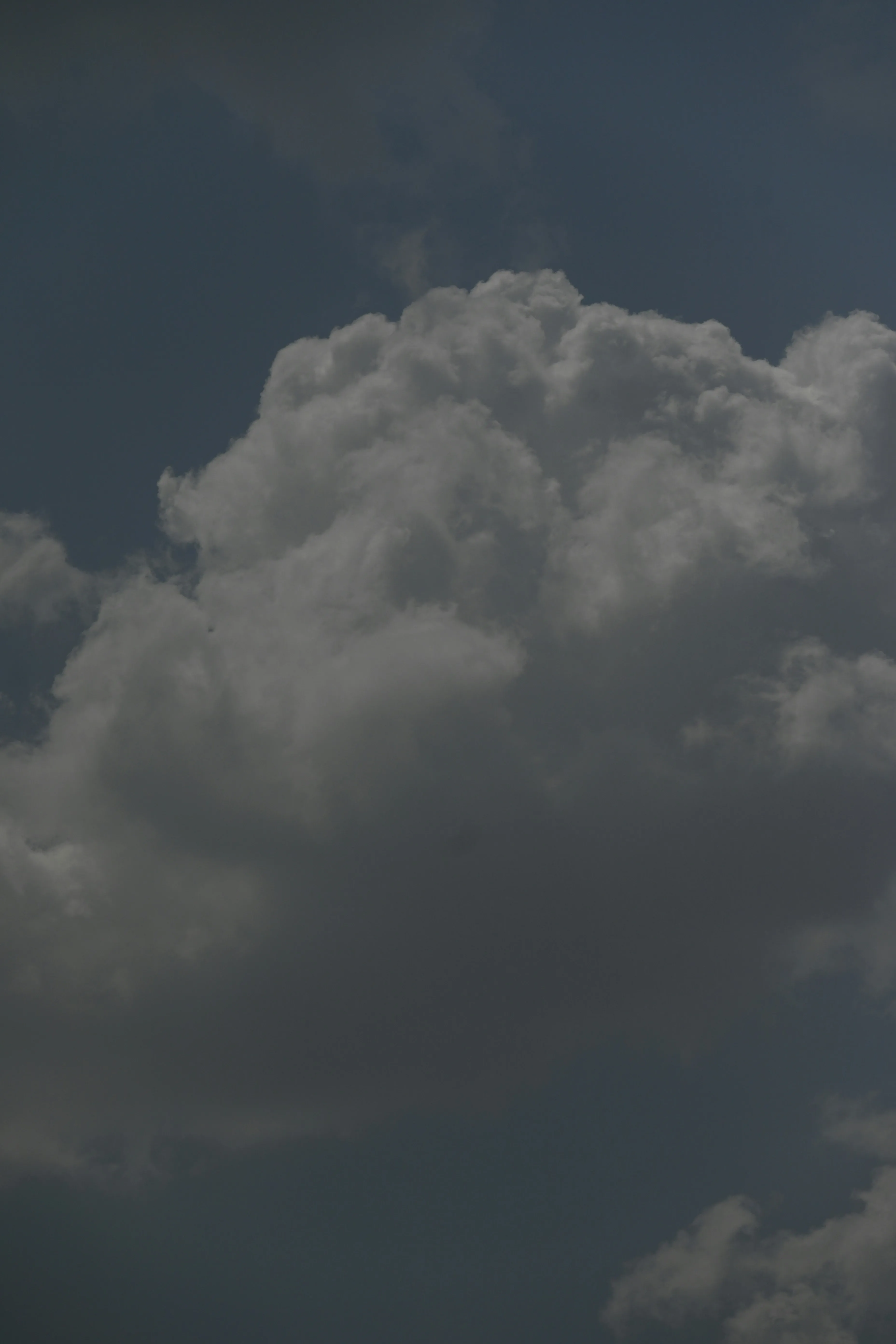 Dark Thunderstorm Cloud Forming in Twilight Sky Wallpaper
