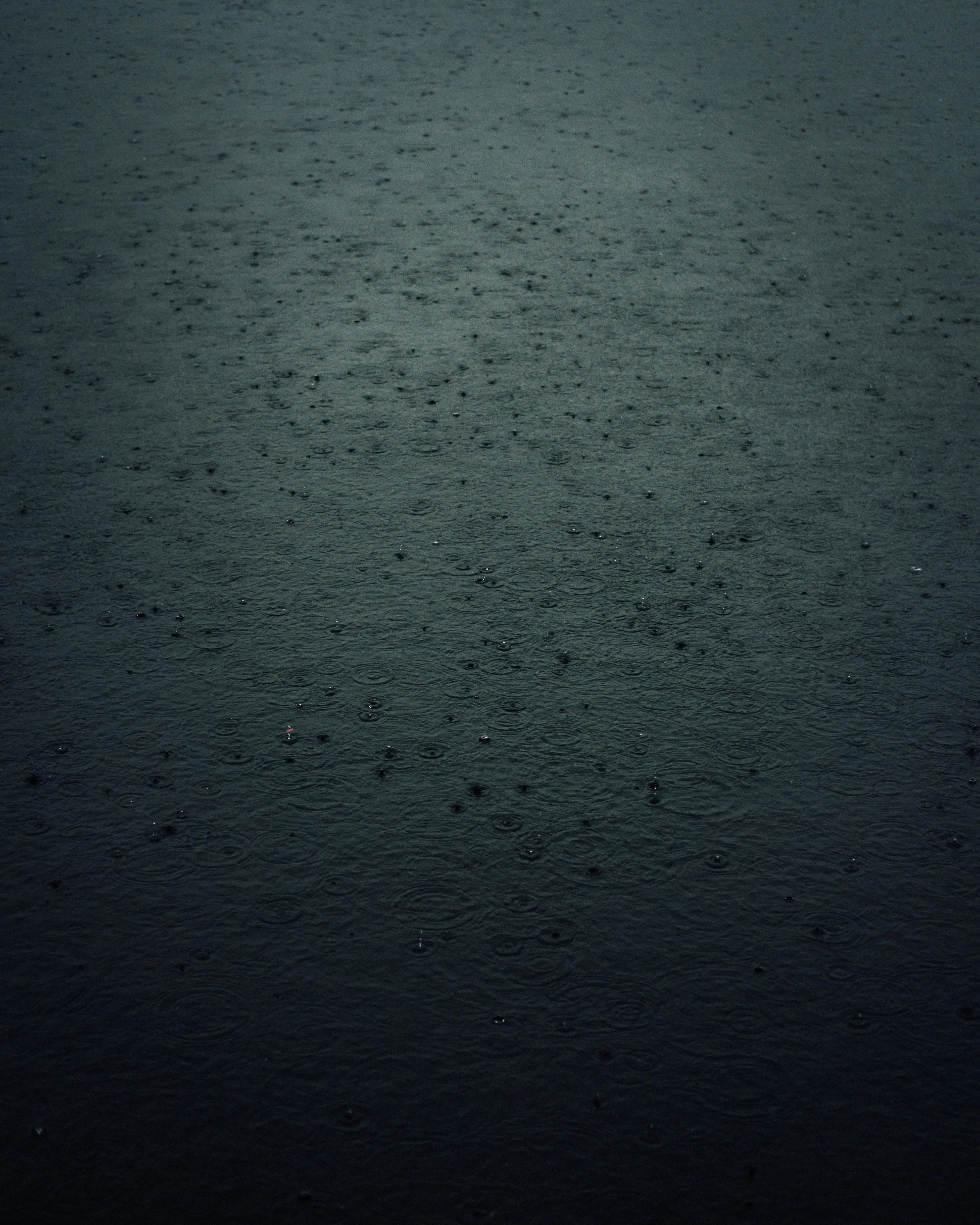 Dark Water Pool with Reflected Light and Rainfall Image