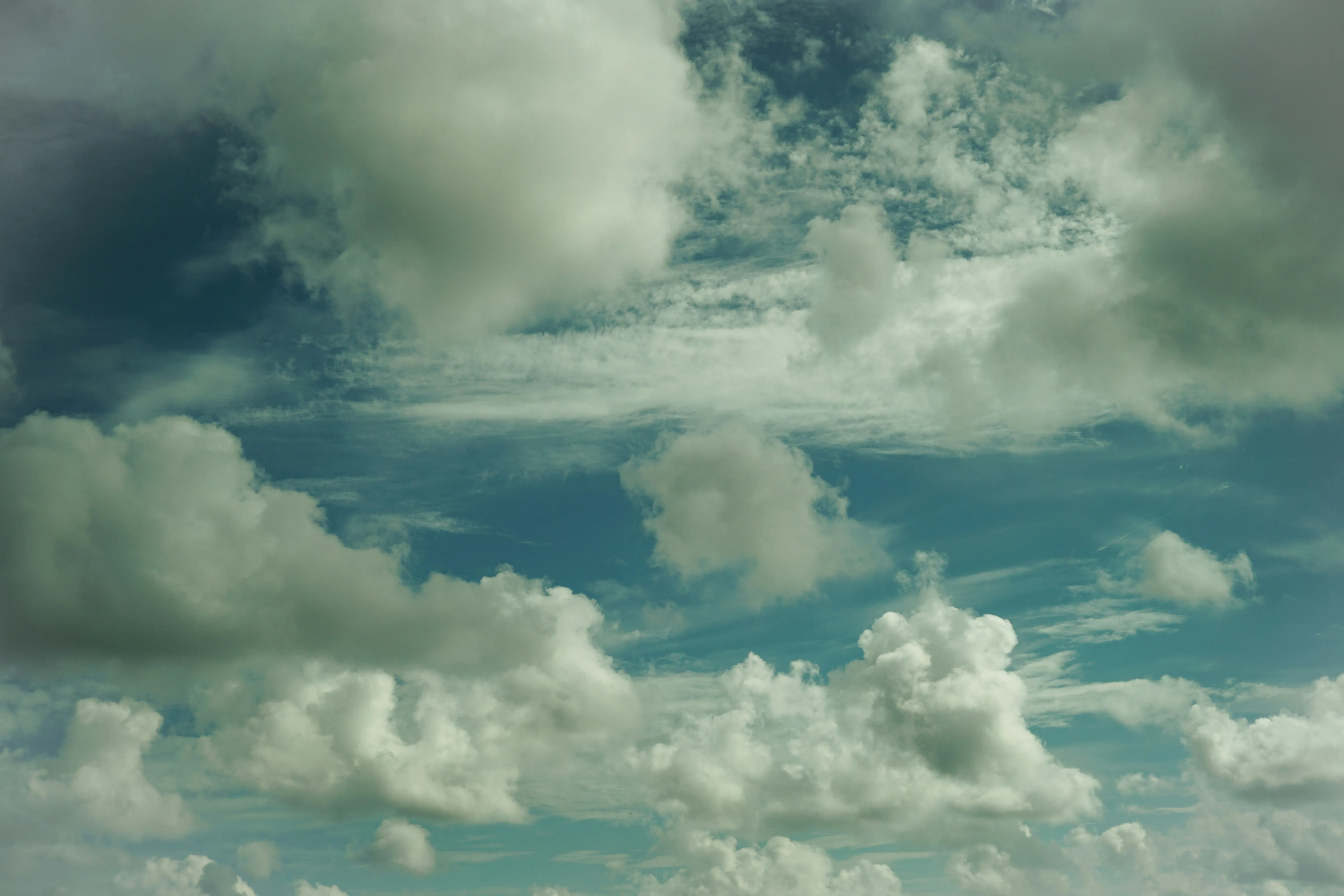 Dense and Dark Clouds Hovering Over Ocean Horizon Wallpaper