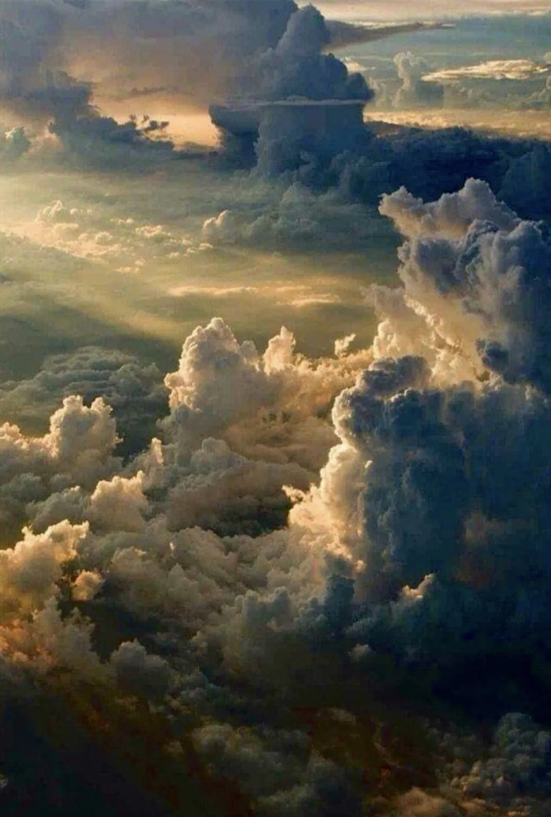 Dramatic Clouds Formation Over the Sky at Sunset Wallpaper