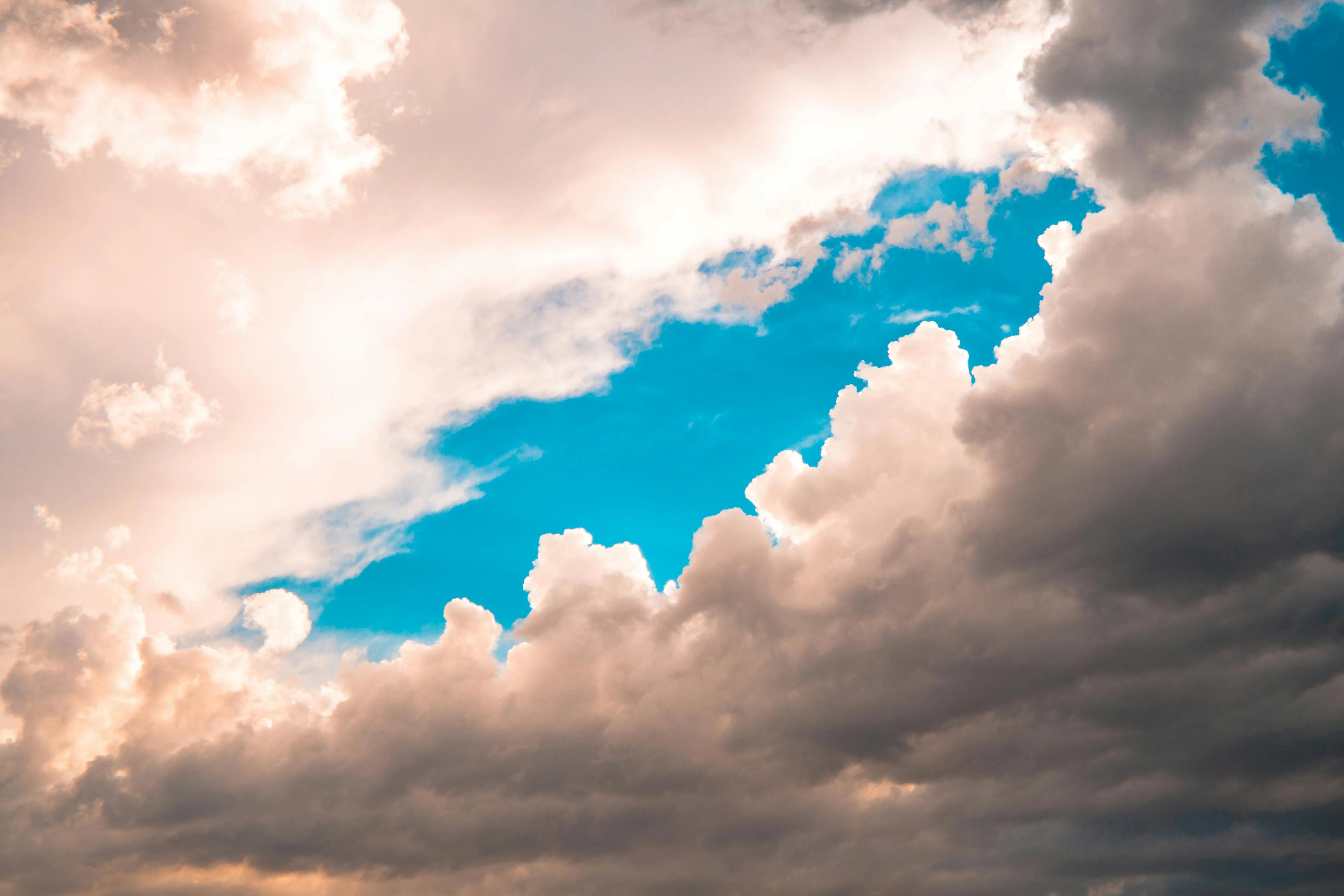 Dramatic Clouds with a Blue Sky Break Over Scenic Landscape