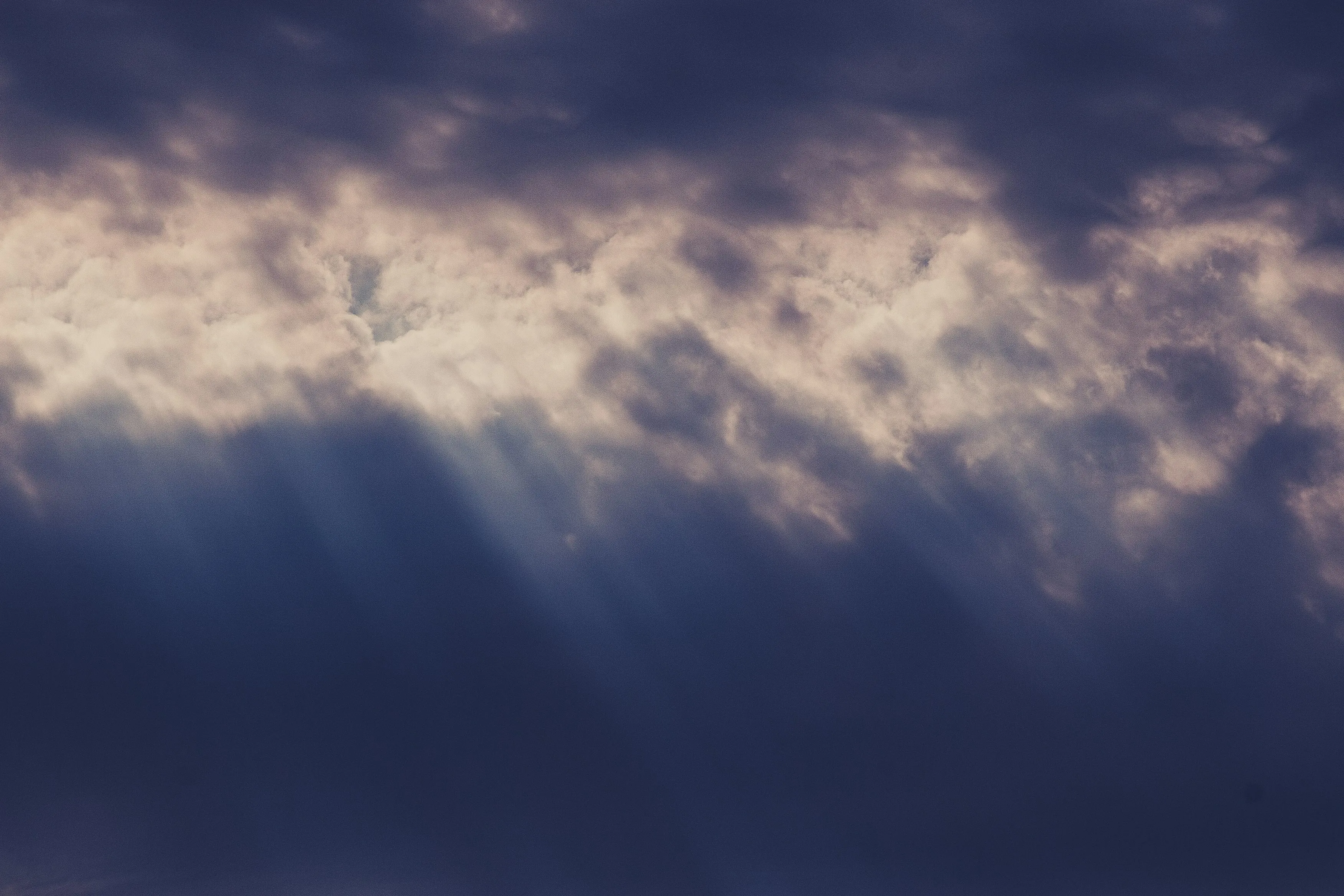 Dramatic Cloudscape with Rays of Sunlight Breaking Through