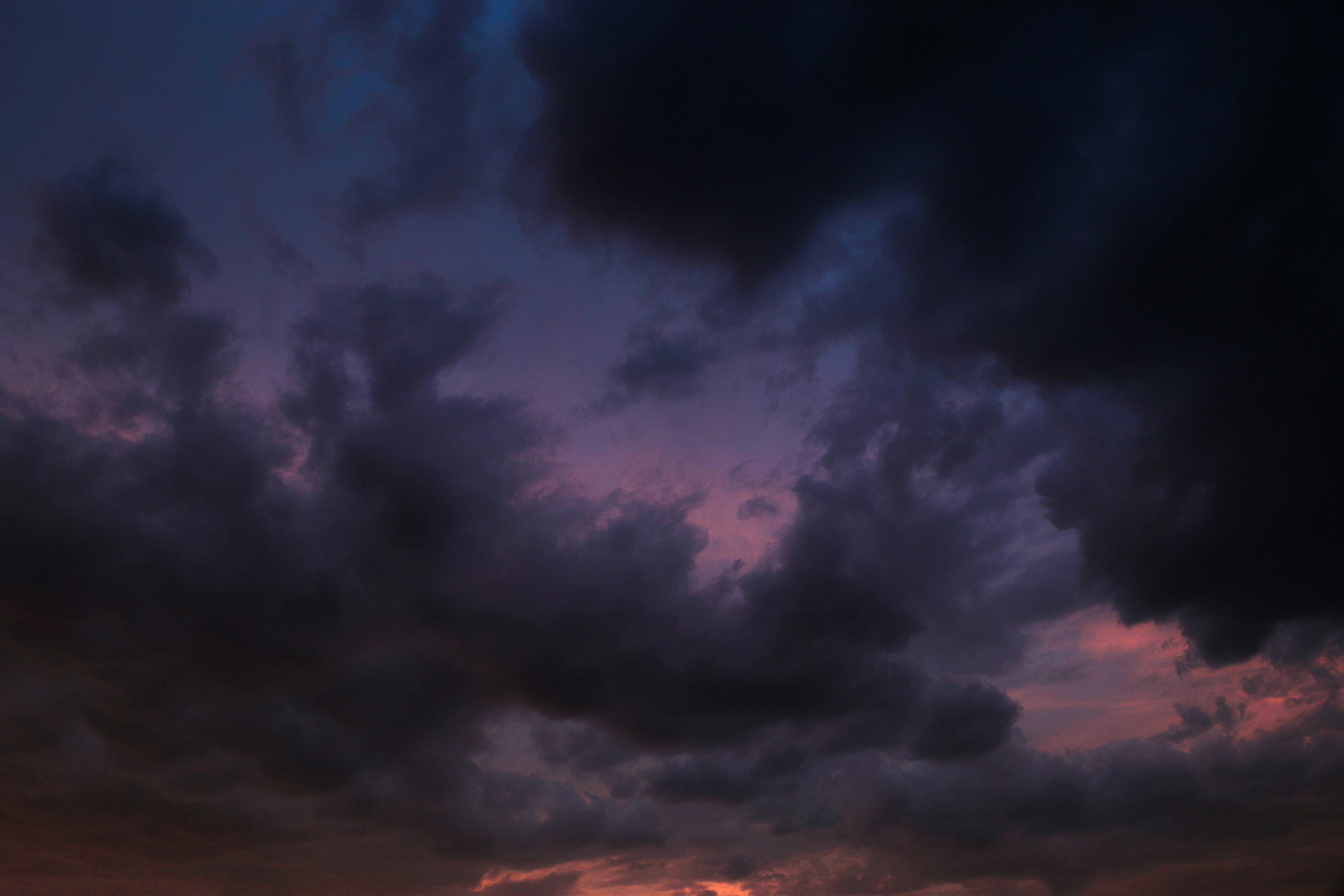 Dramatic Purple Sky with Storm Clouds at Sunset Wallpaper