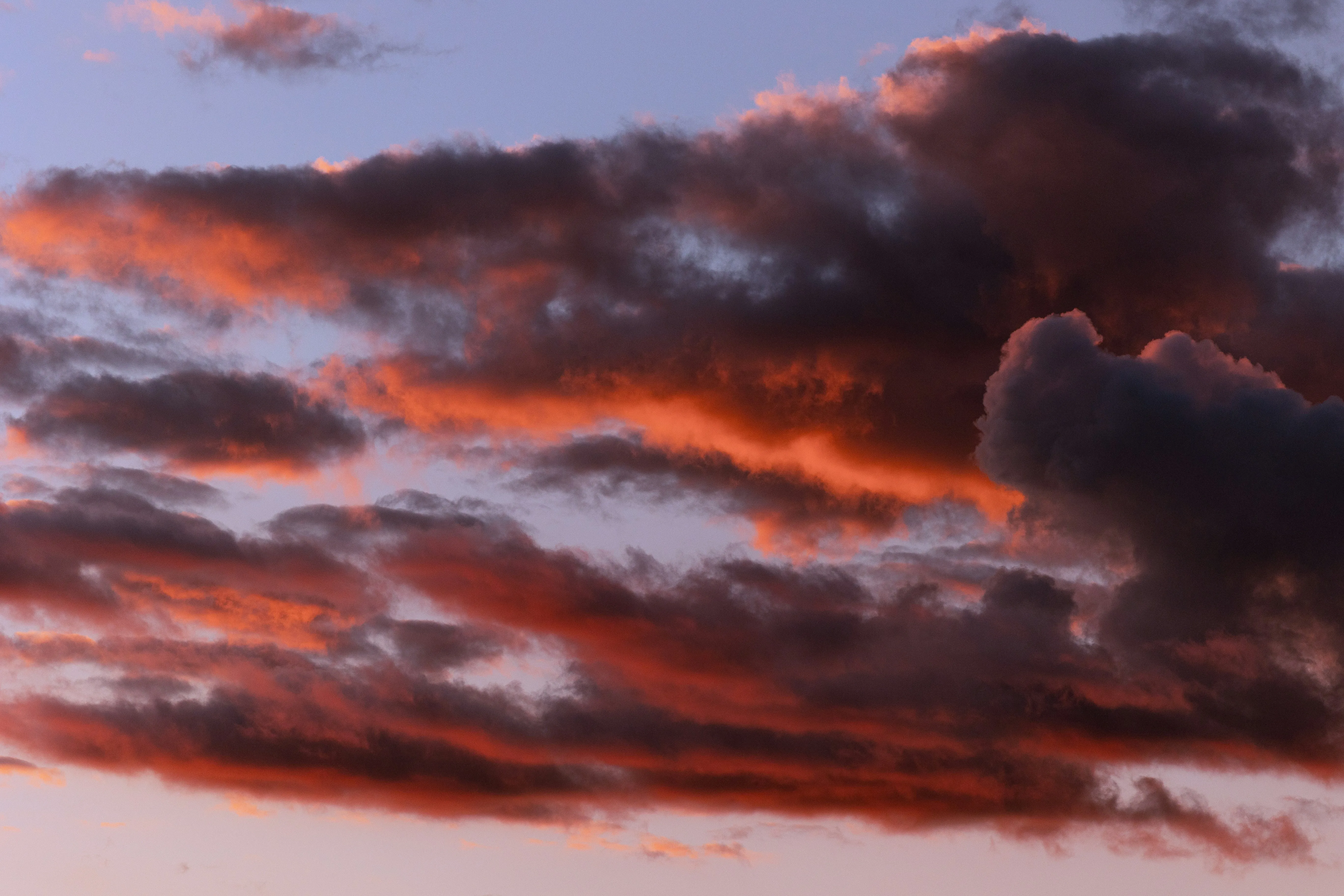 Dramatic Red and Dark Clouds Creating a Stunning Sunset Sky