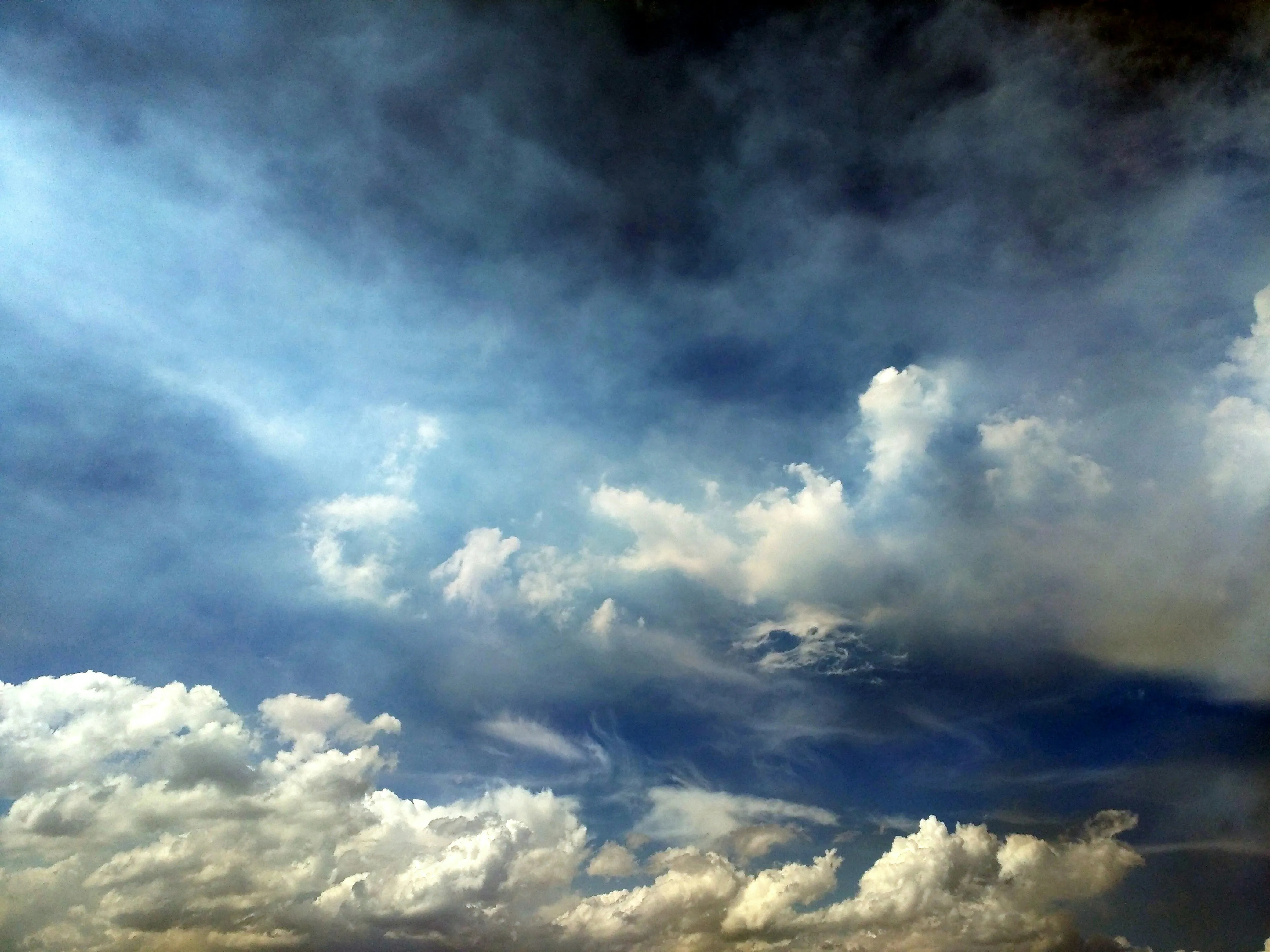 Dramatic Storm Clouds Gathering Over the Horizon Wallpaper
