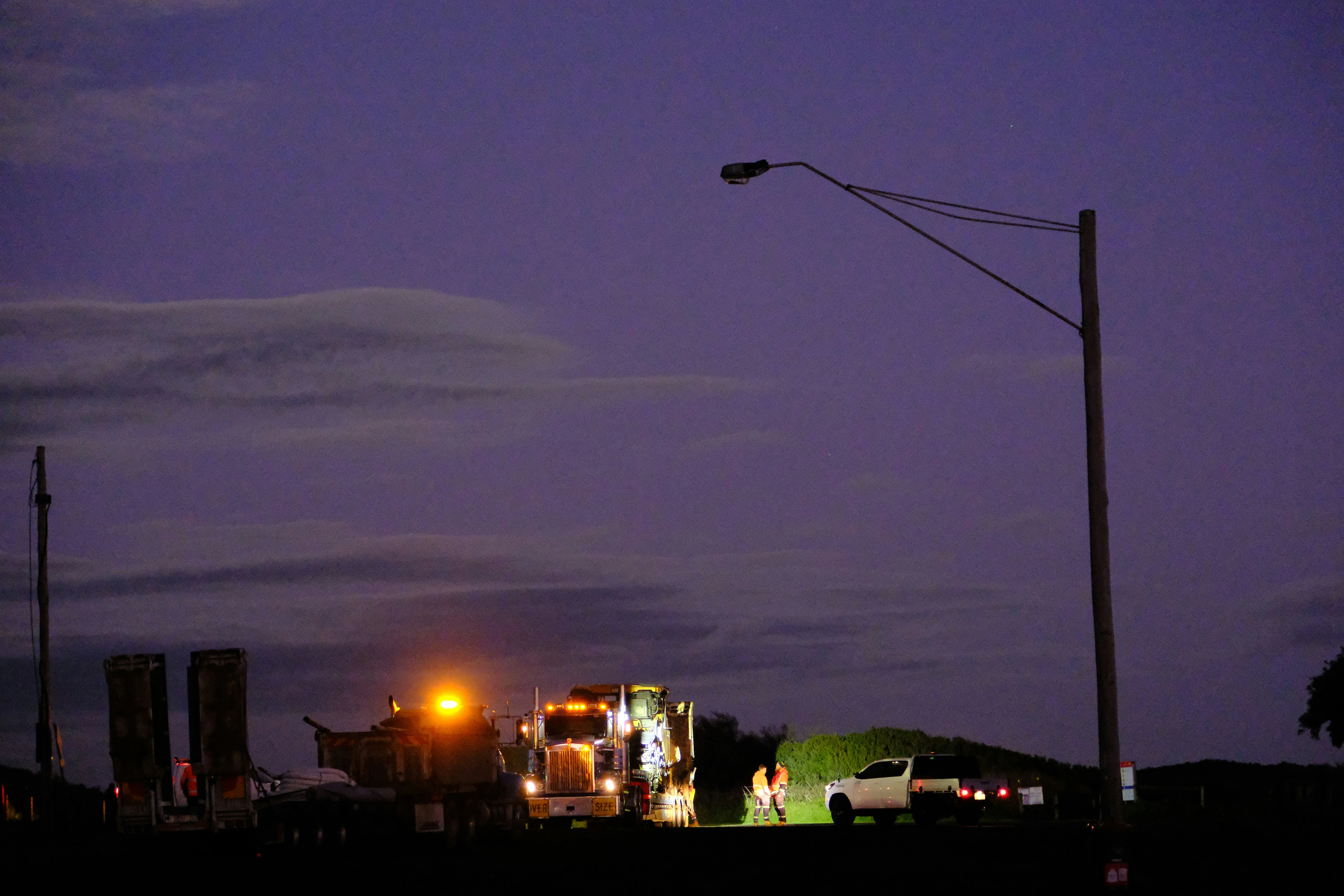 Evening City Street View with Sparse and Low Hanging Clouds