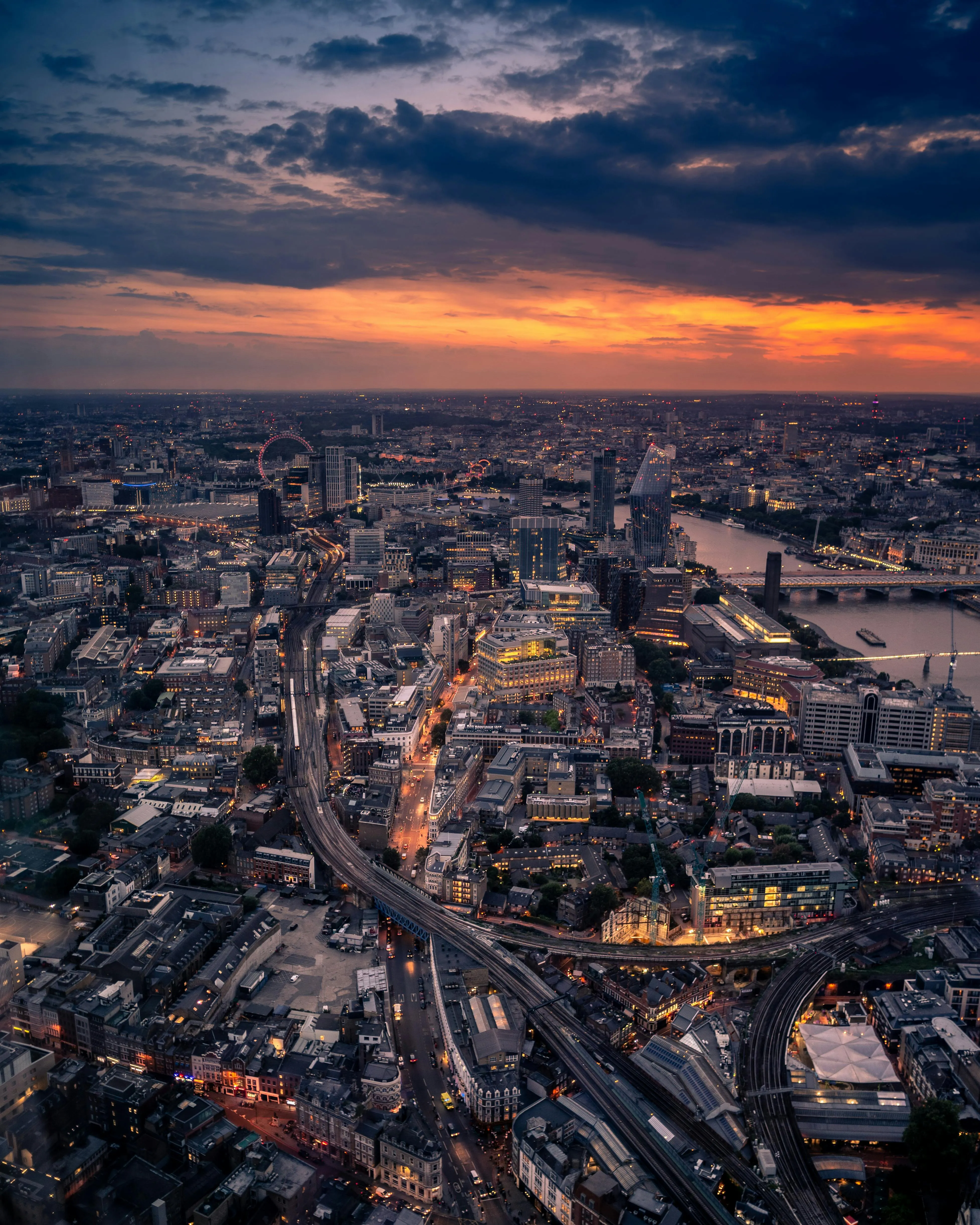 Evening Skyline with Street Lights and Cloudy Sky Image