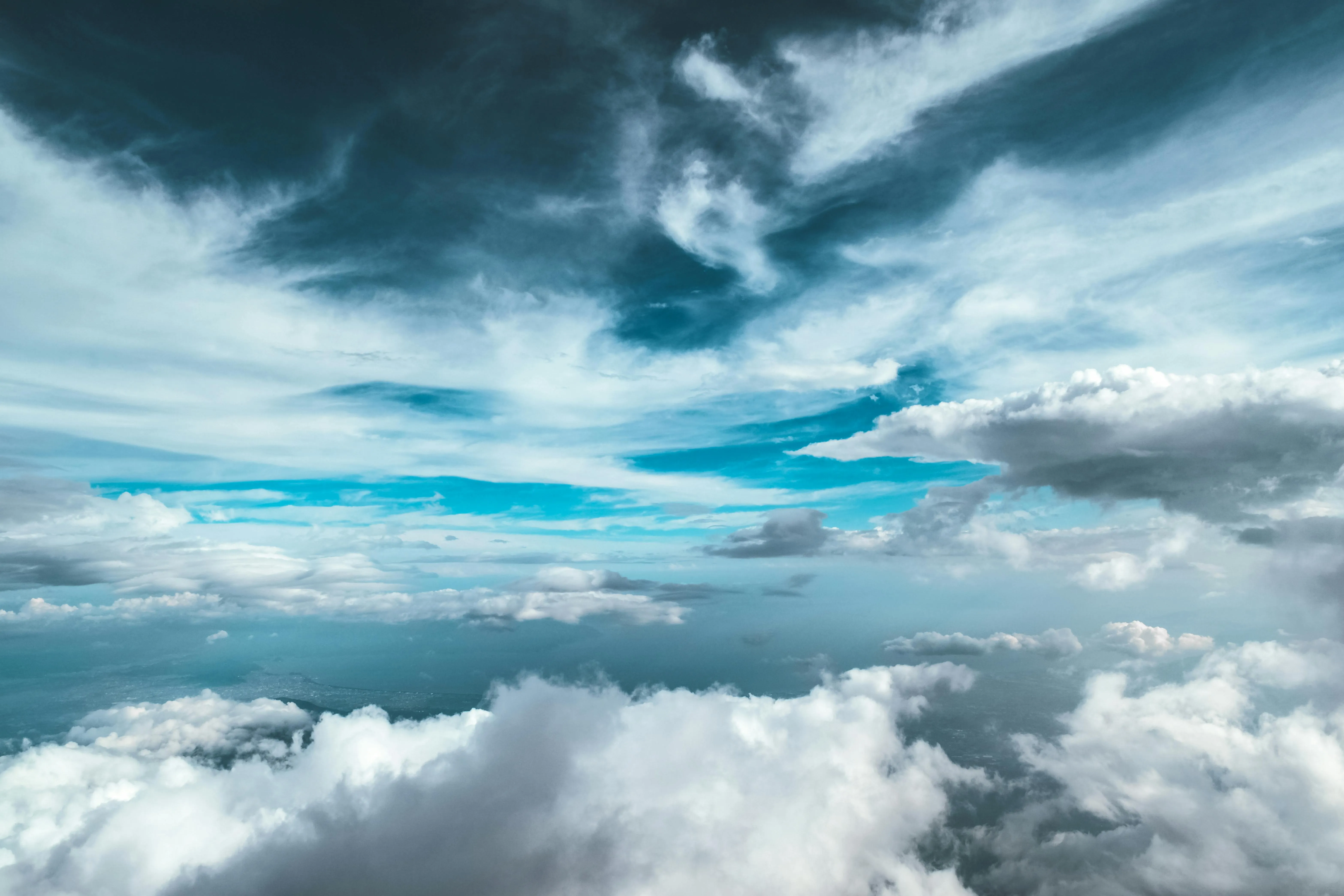 Expansive Blue Sky Filled with Thick White Clouds Wallpaper