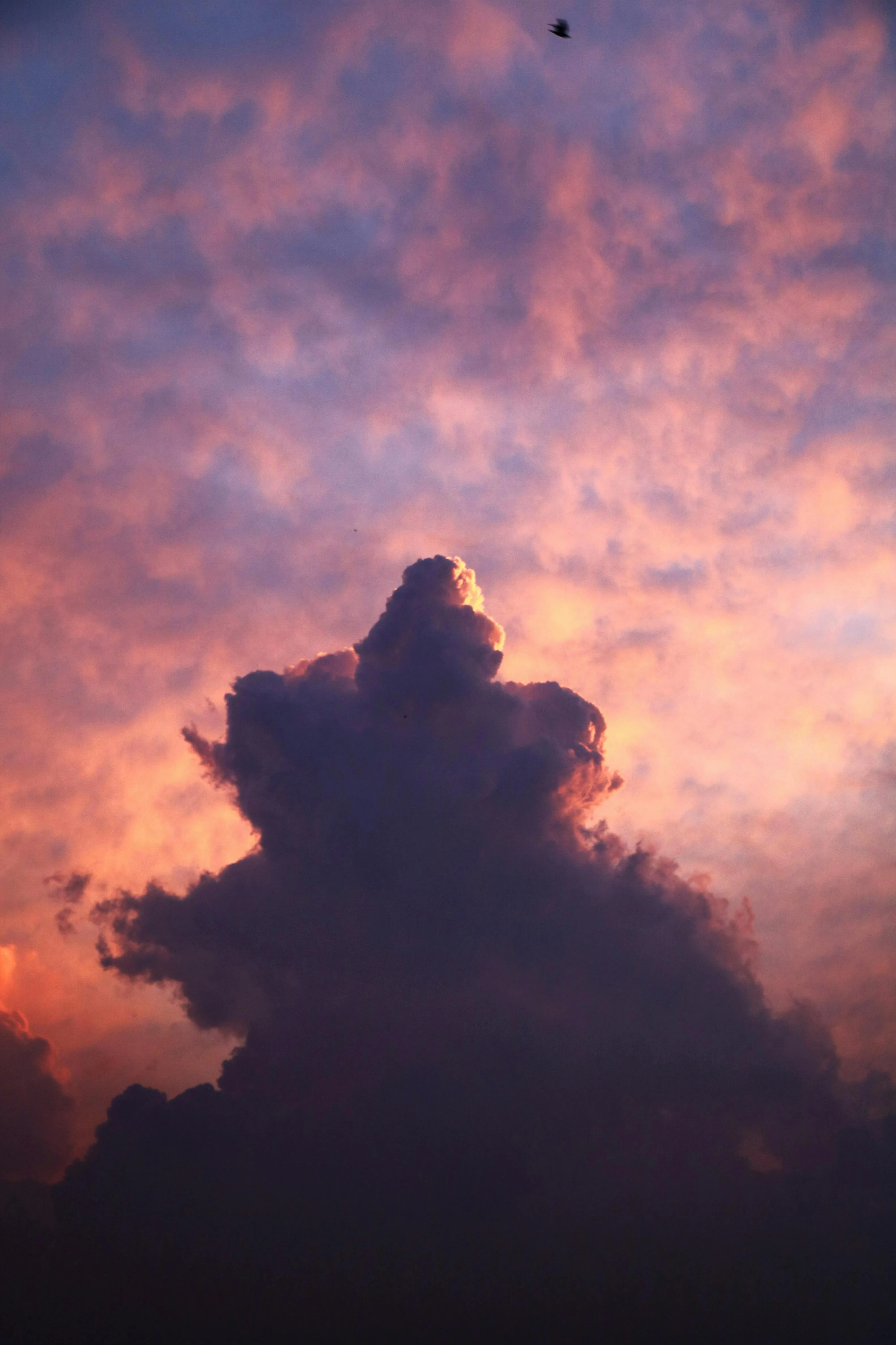Fiery Sunset Lighting Up a Towering Cloud Form Wallpaper