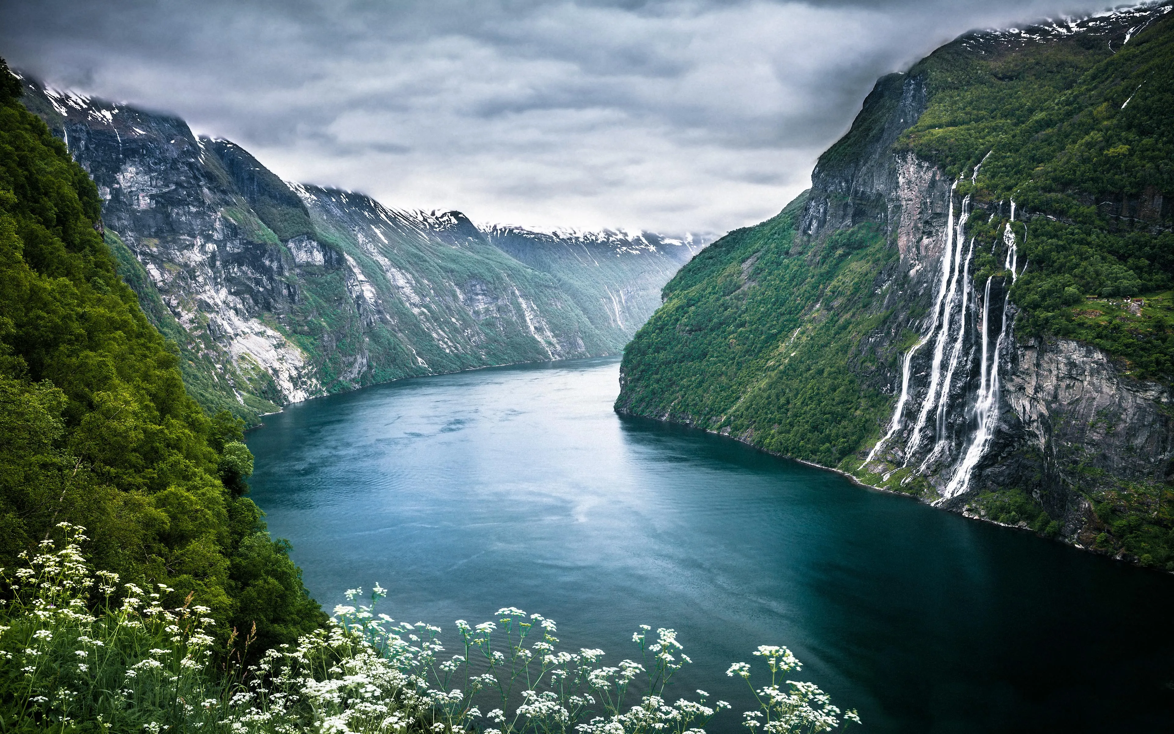 Fjord view with high cliffs and water winding below