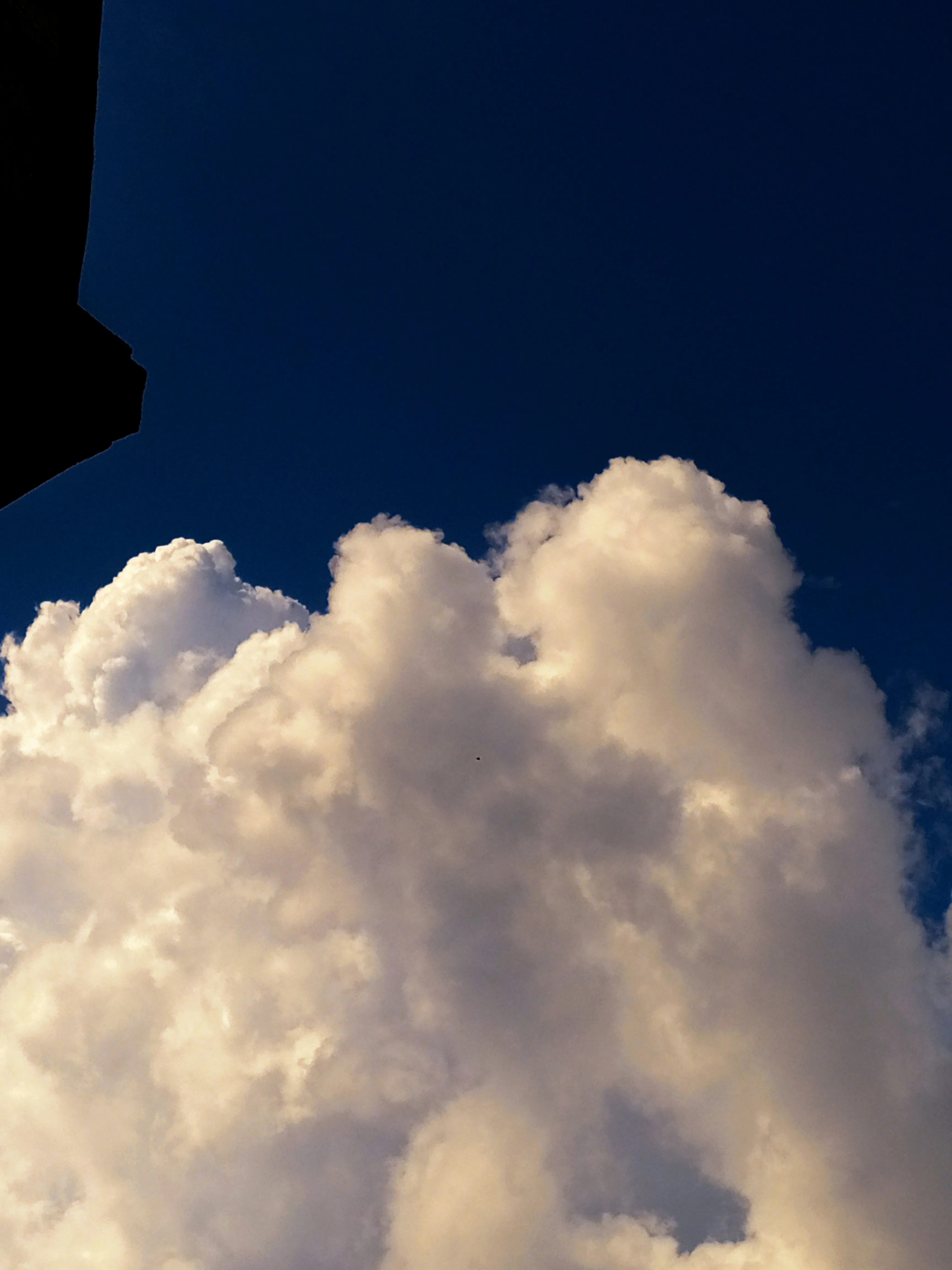 Fluffy Clouds Against a Dark Blue Night Sky Photography