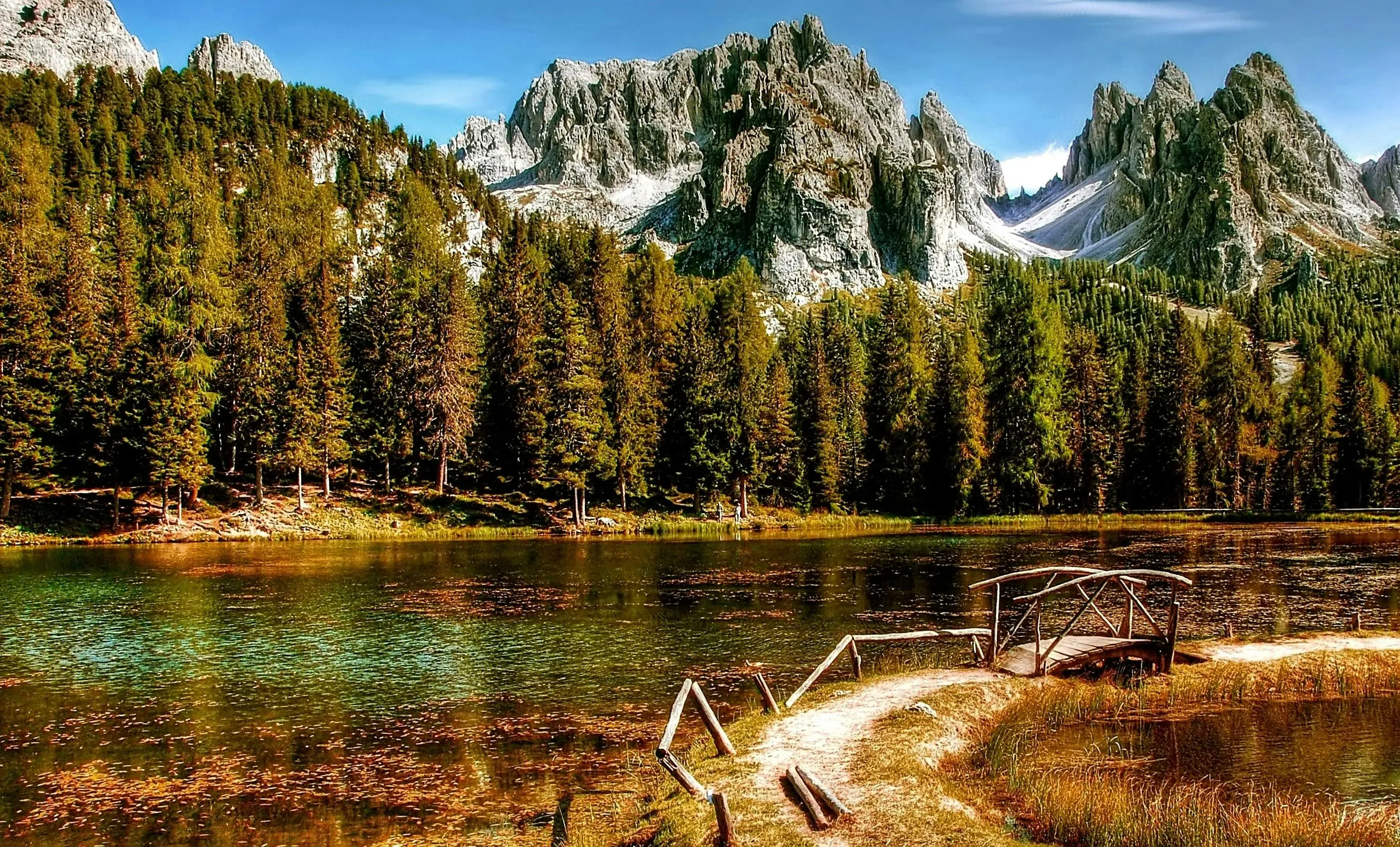 Forest Lake Reflecting Autumn Trees and Mountain Peaks
