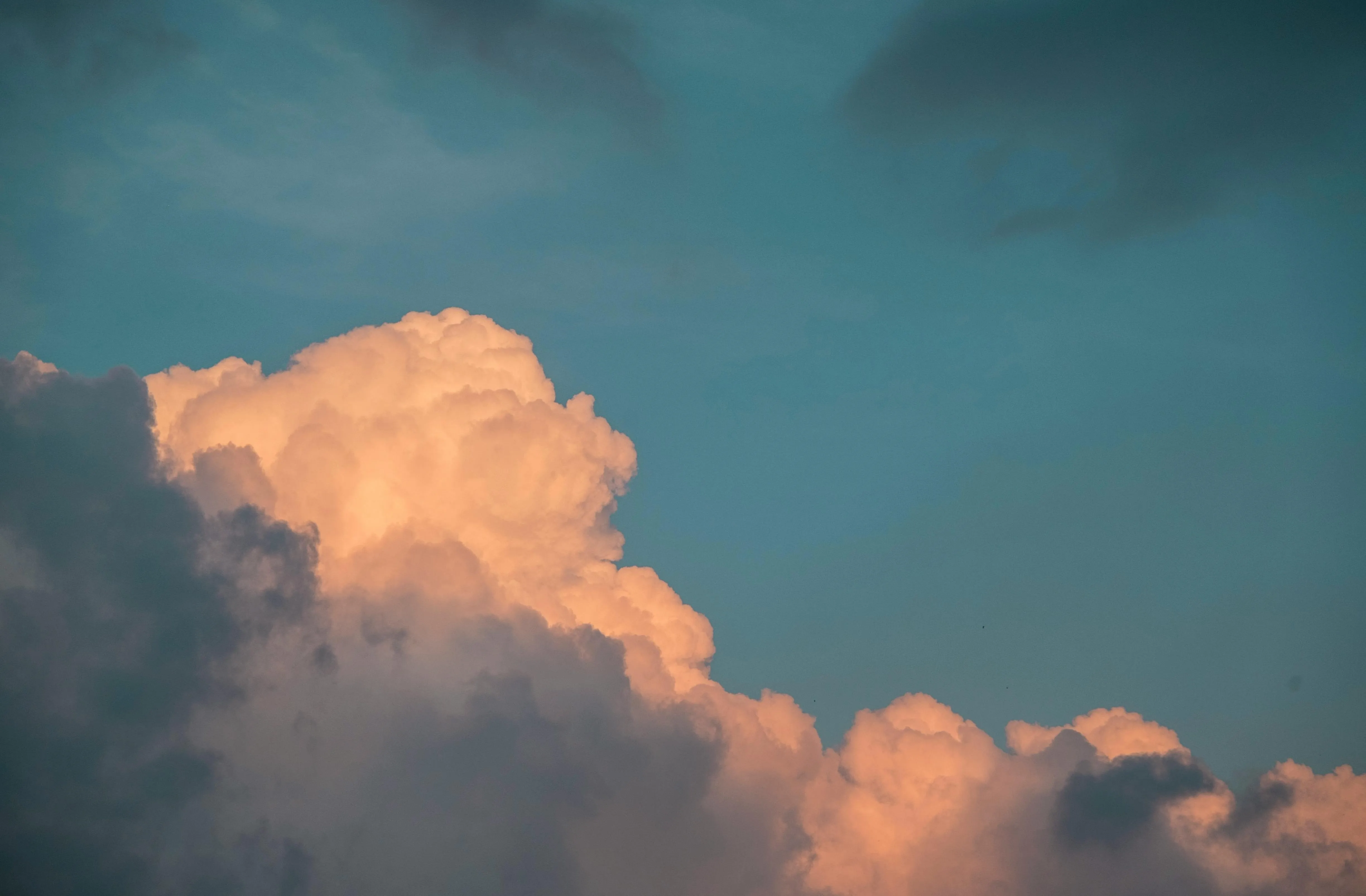 Glowing Cumulus Clouds at Twilight with Peaceful Sky