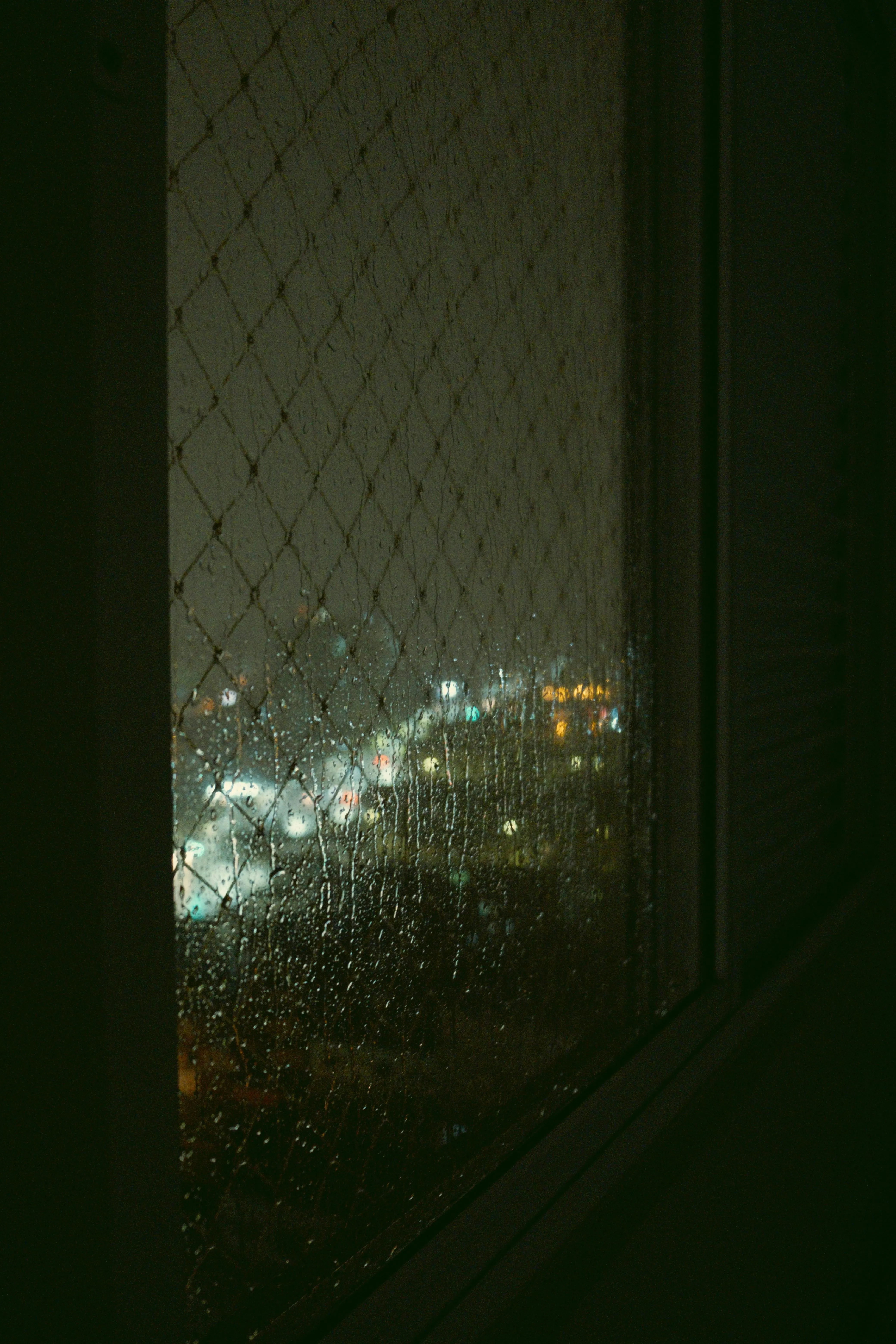 Glowing Street Light Seen Through Heavy Rainfall Image