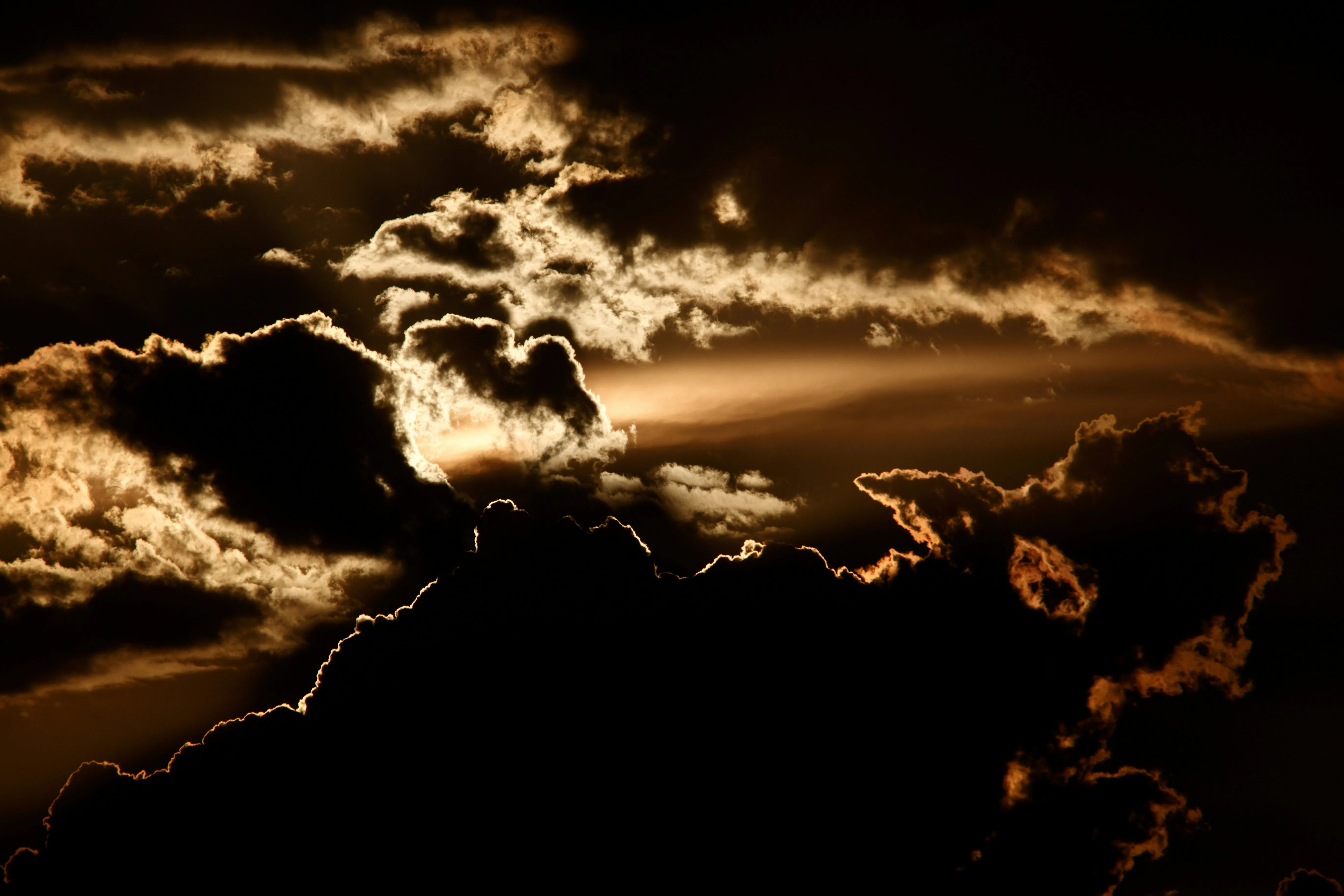 Golden Clouds Illuminated Dramatically at Sunset Hour