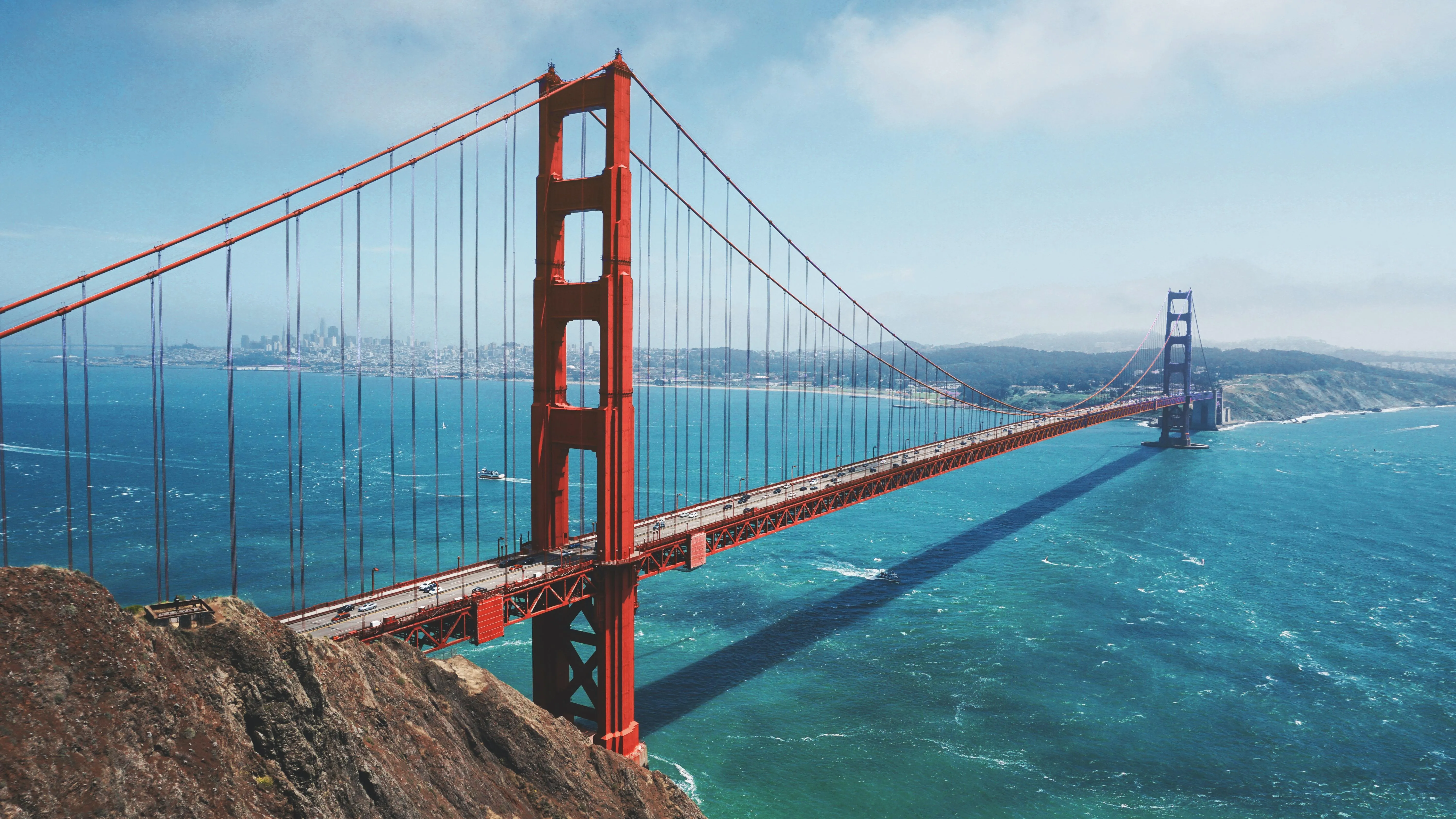 Golden Gate Bridge Spanning Over Blue Water Wallpaper