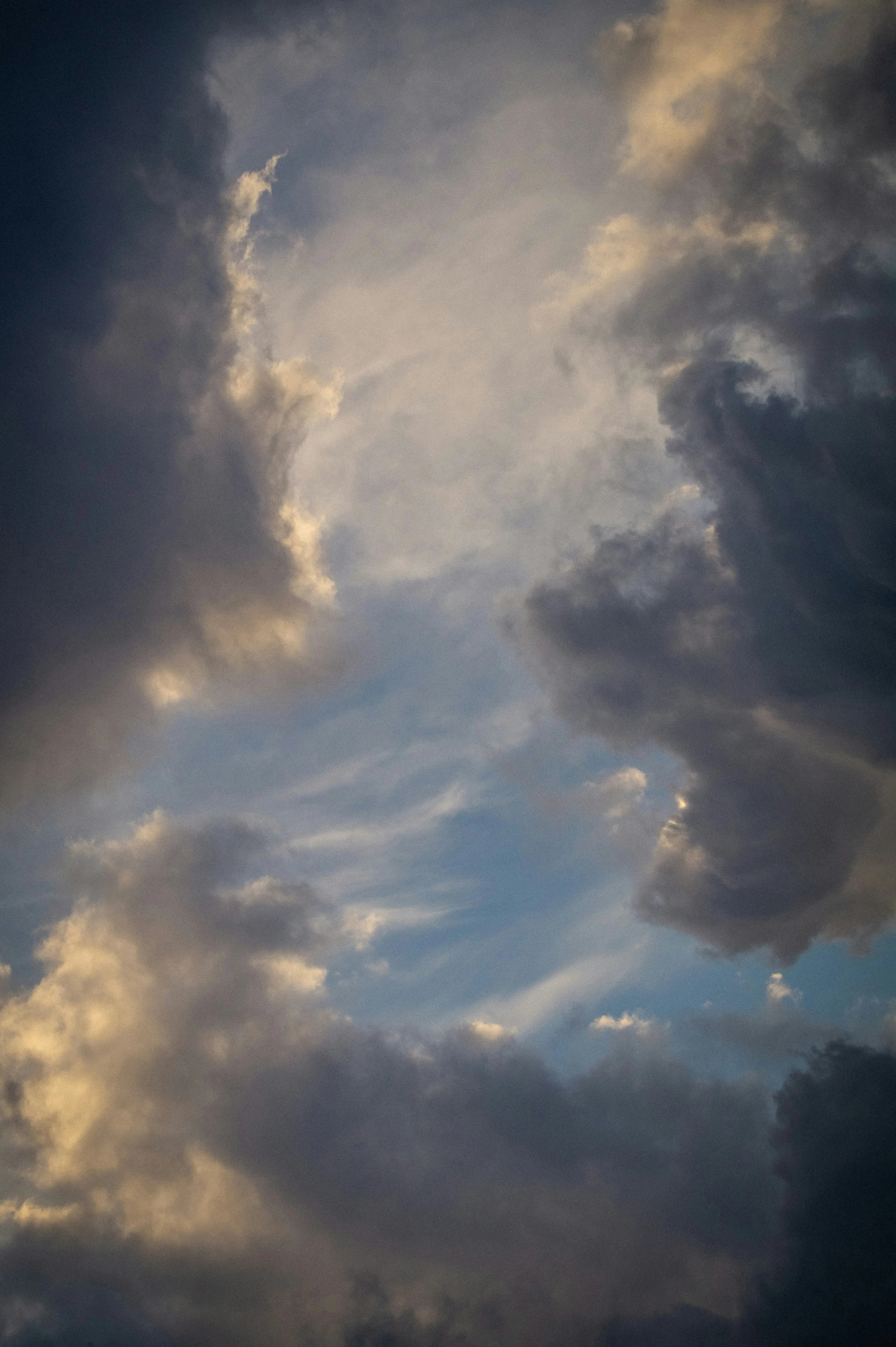 Golden Hour Sky with Dramatic Stormy Clouds Wallpaper
