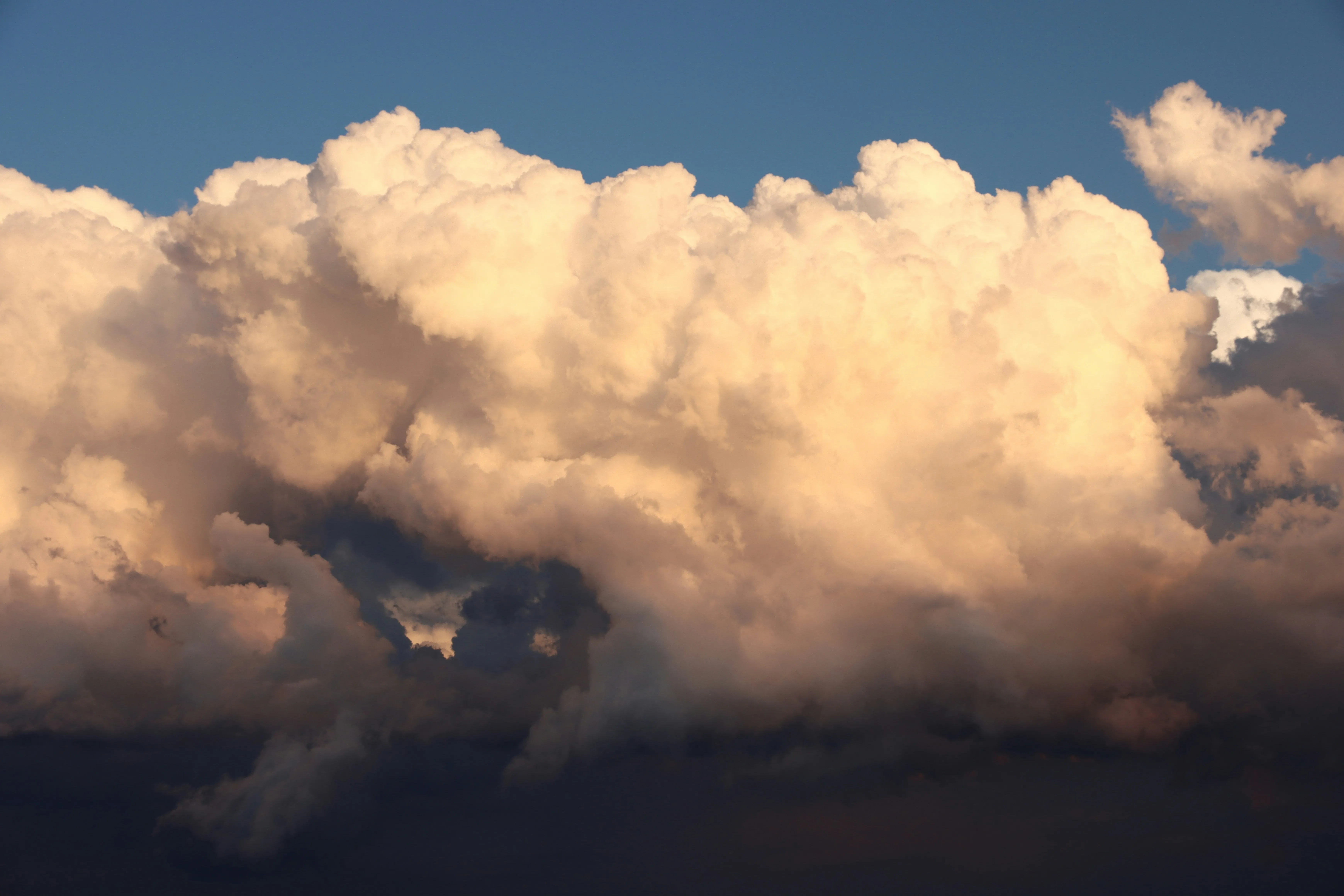 Golden Sunset Clouds with Dramatic Sky Lighting Over Landscape