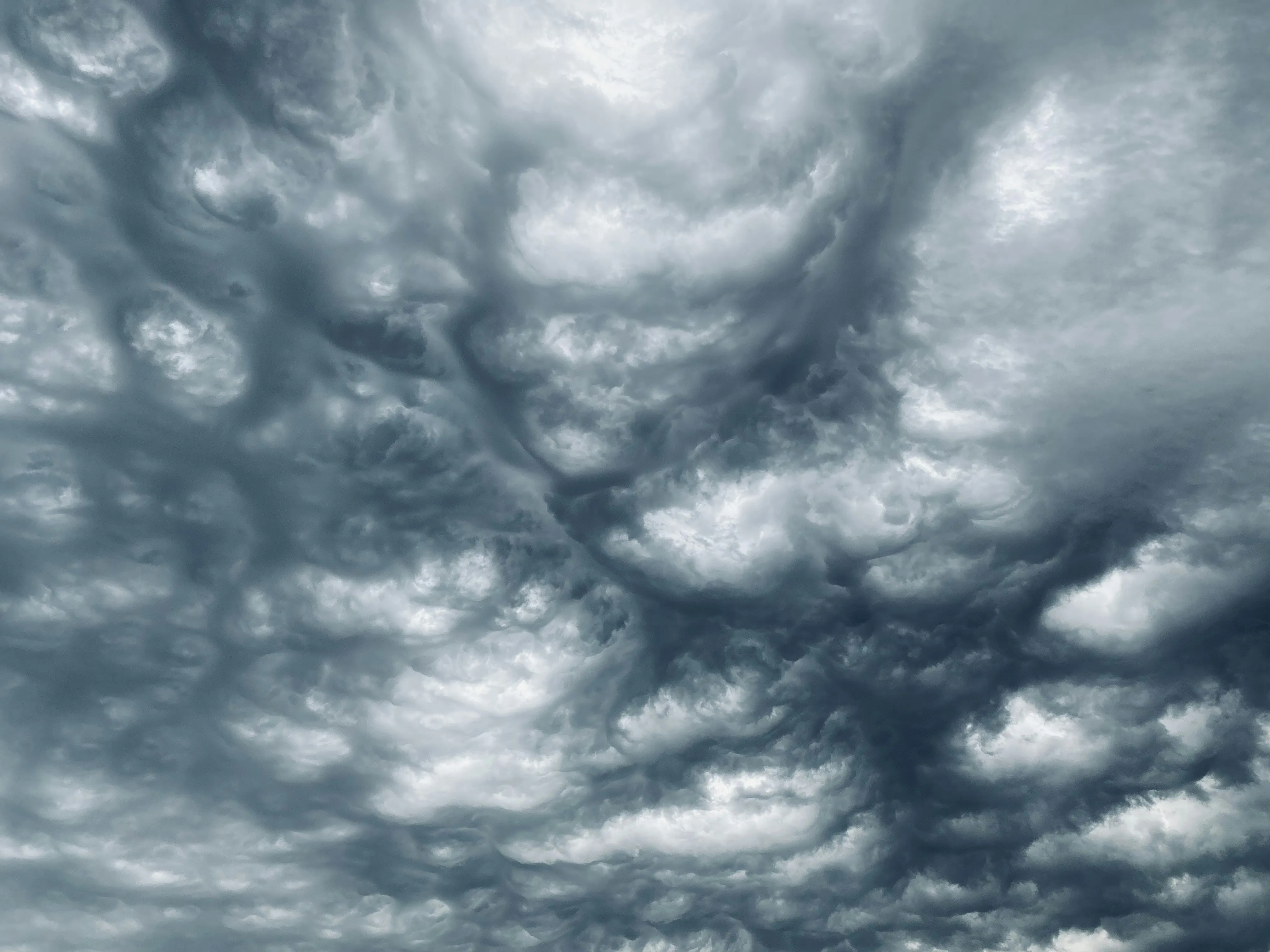 Gray Cloud Formation Swirling in Turbulent Atmospheric Layer