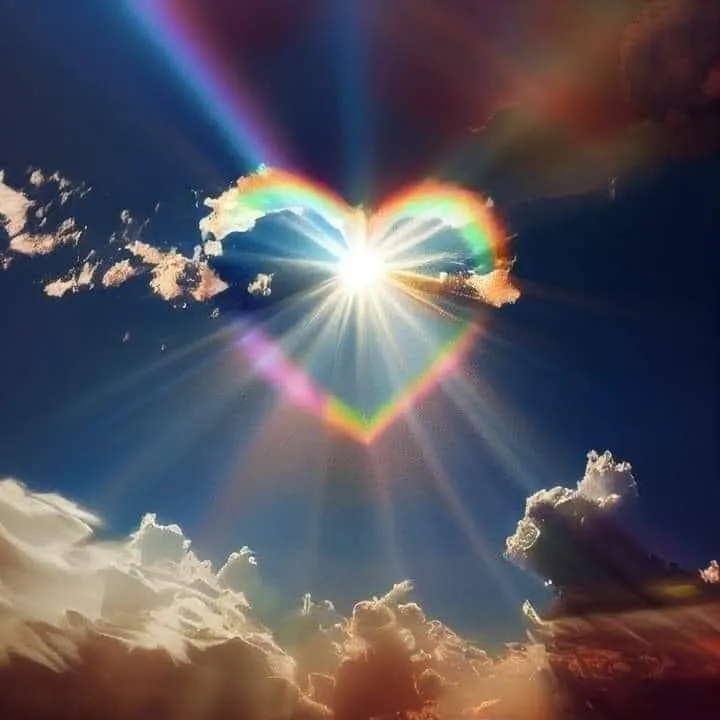 Heart Shaped Sun Rays Shining Through Colorful Clouds