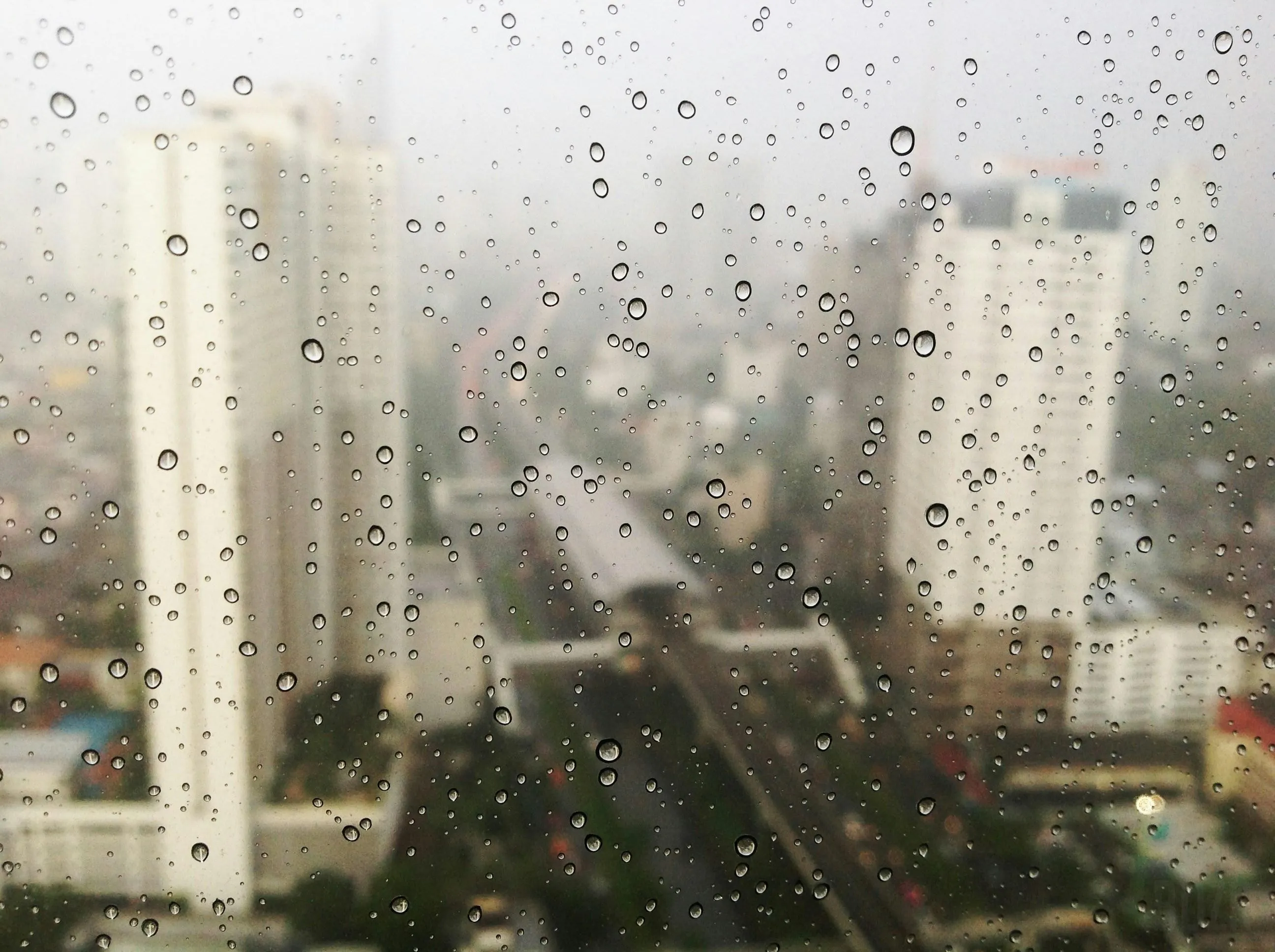 High Rise Building Windows Covered in Rain Drops