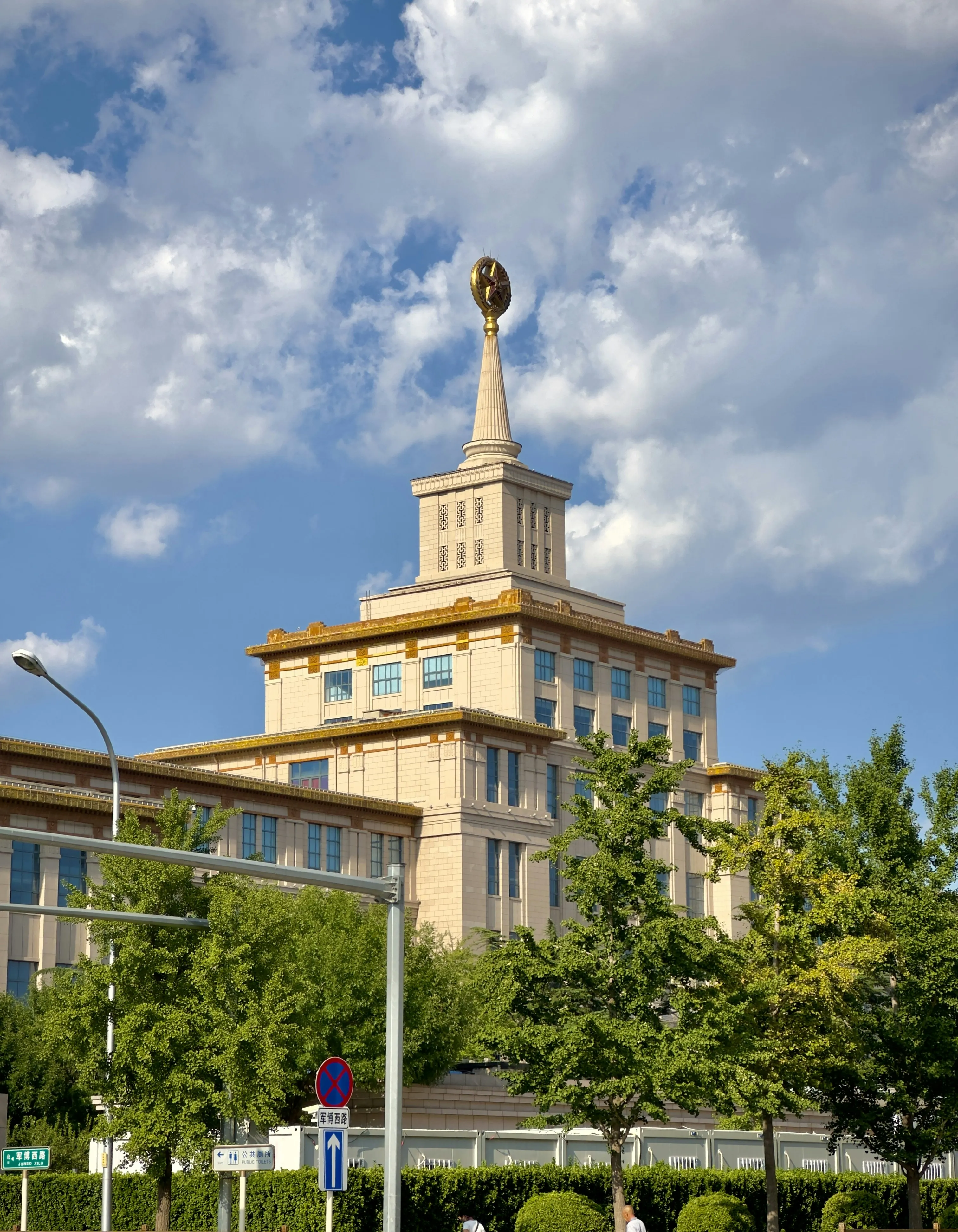 Historic Yellow Building Under a Bright Blue Sky Wallpaper