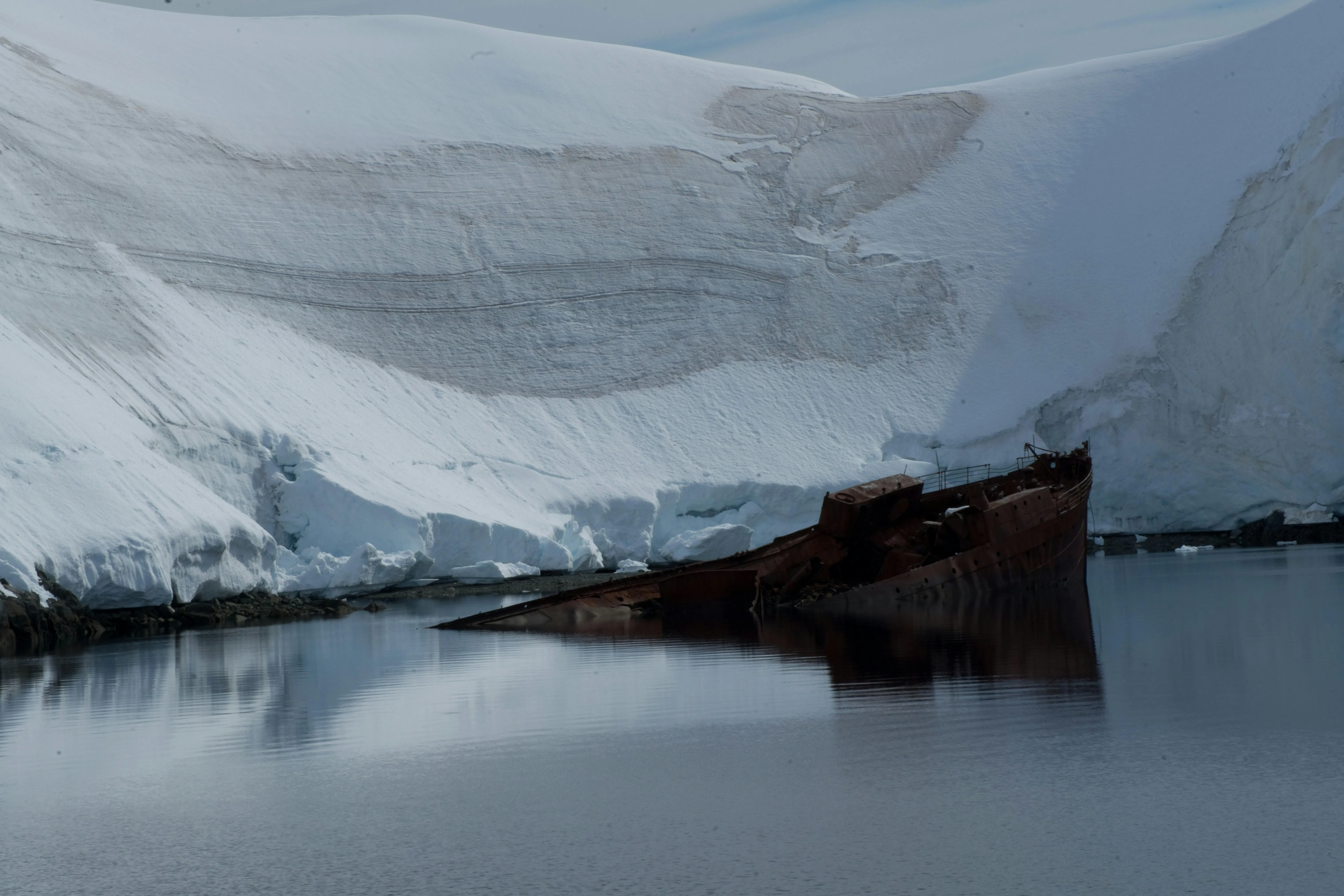 Ice Covered Ocean Pier Extending into Cold Water image