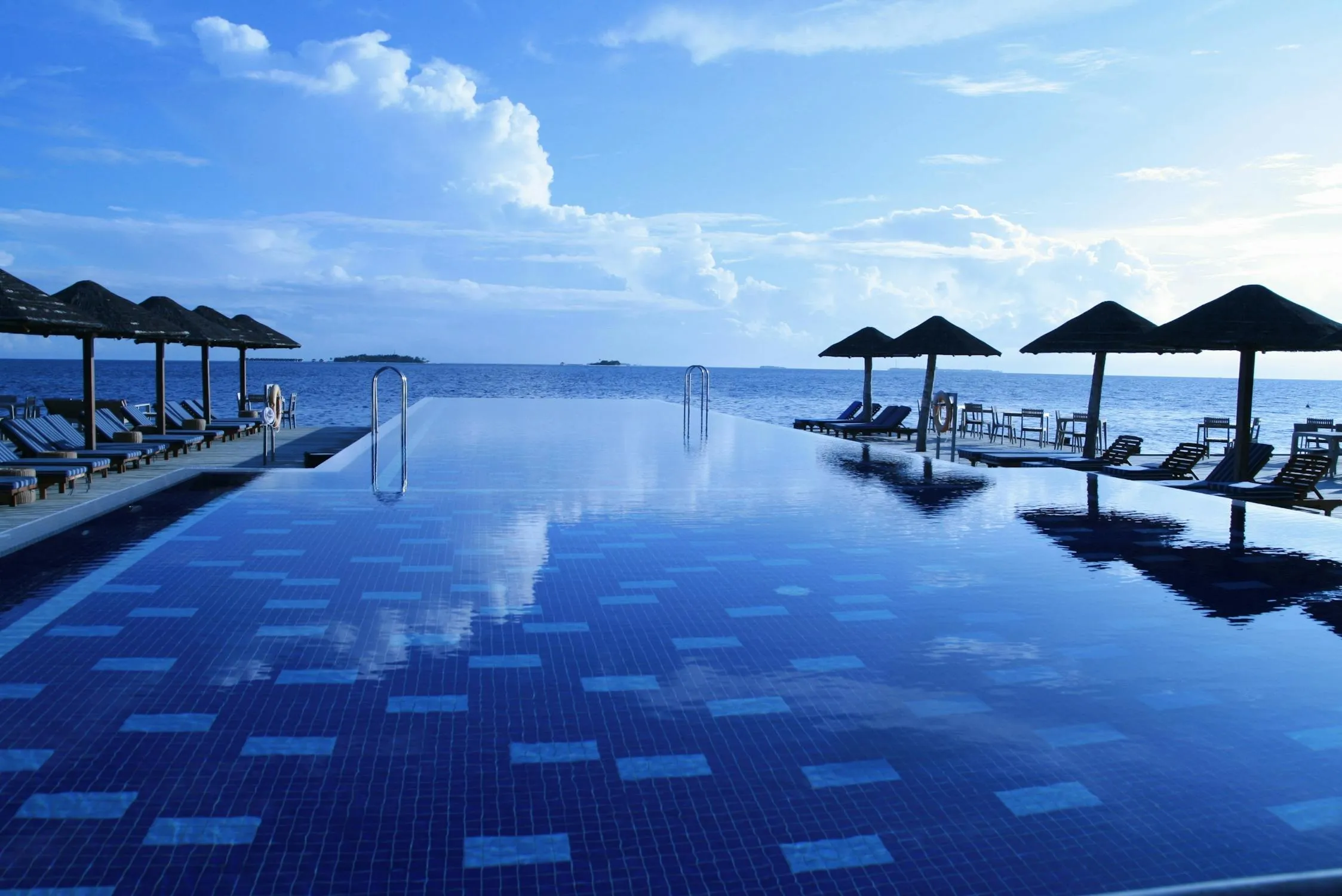 Infinity Pool Overlooking Cloudy Blue Horizon Photography