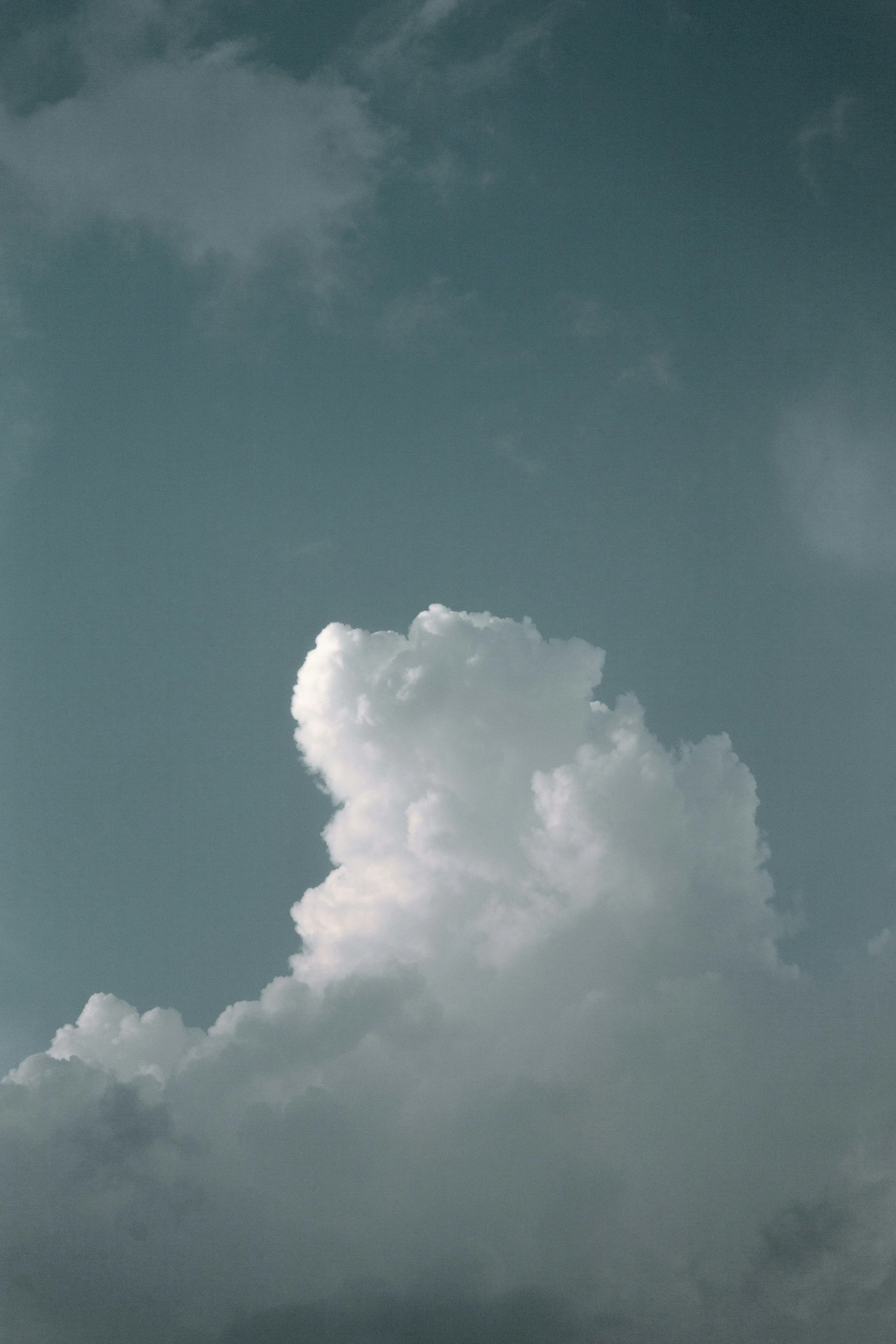 Isolated Cloud Over a Moody Teal Colored Sky Image HD