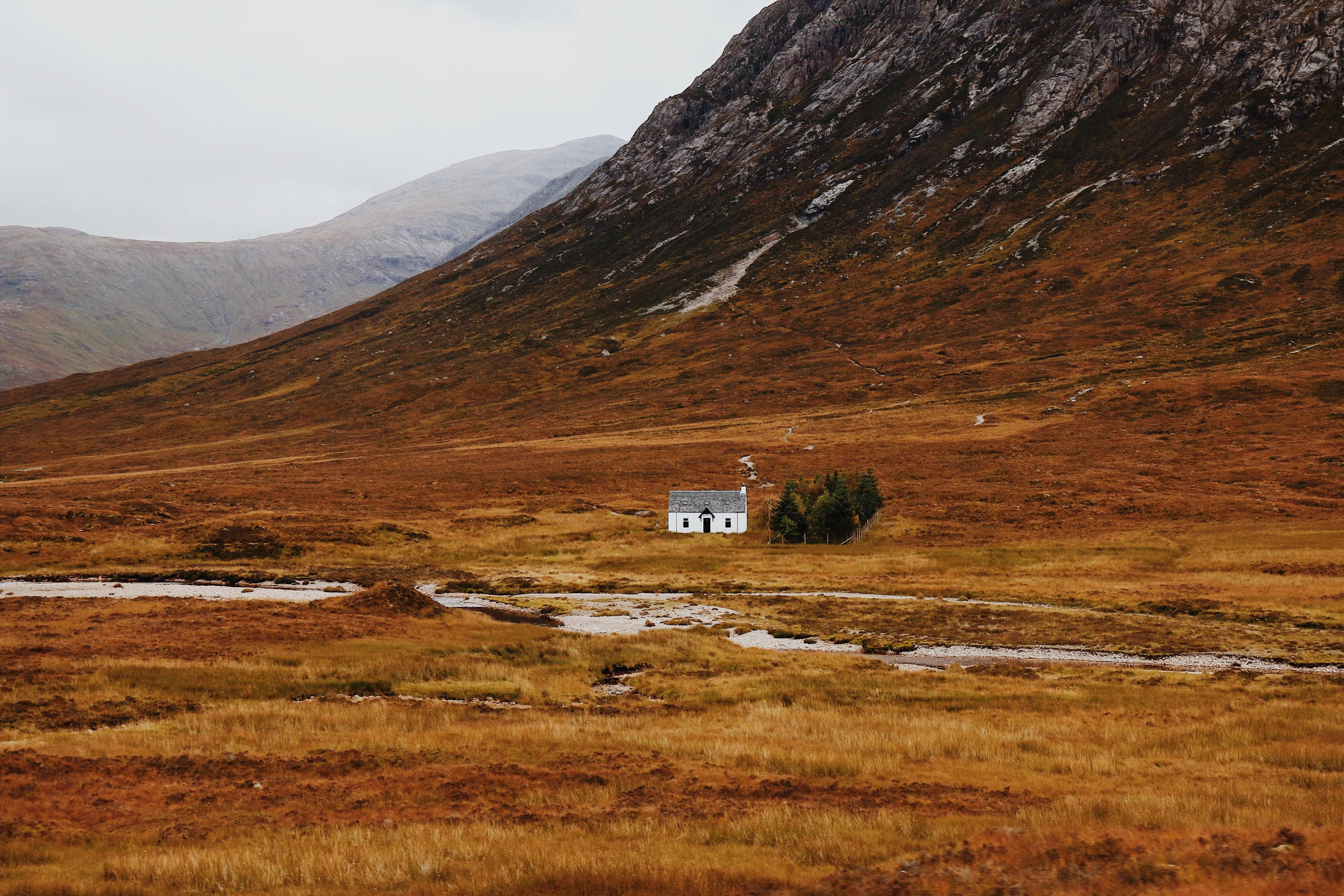 Isolated House on Red and Brown Autumn Hills image