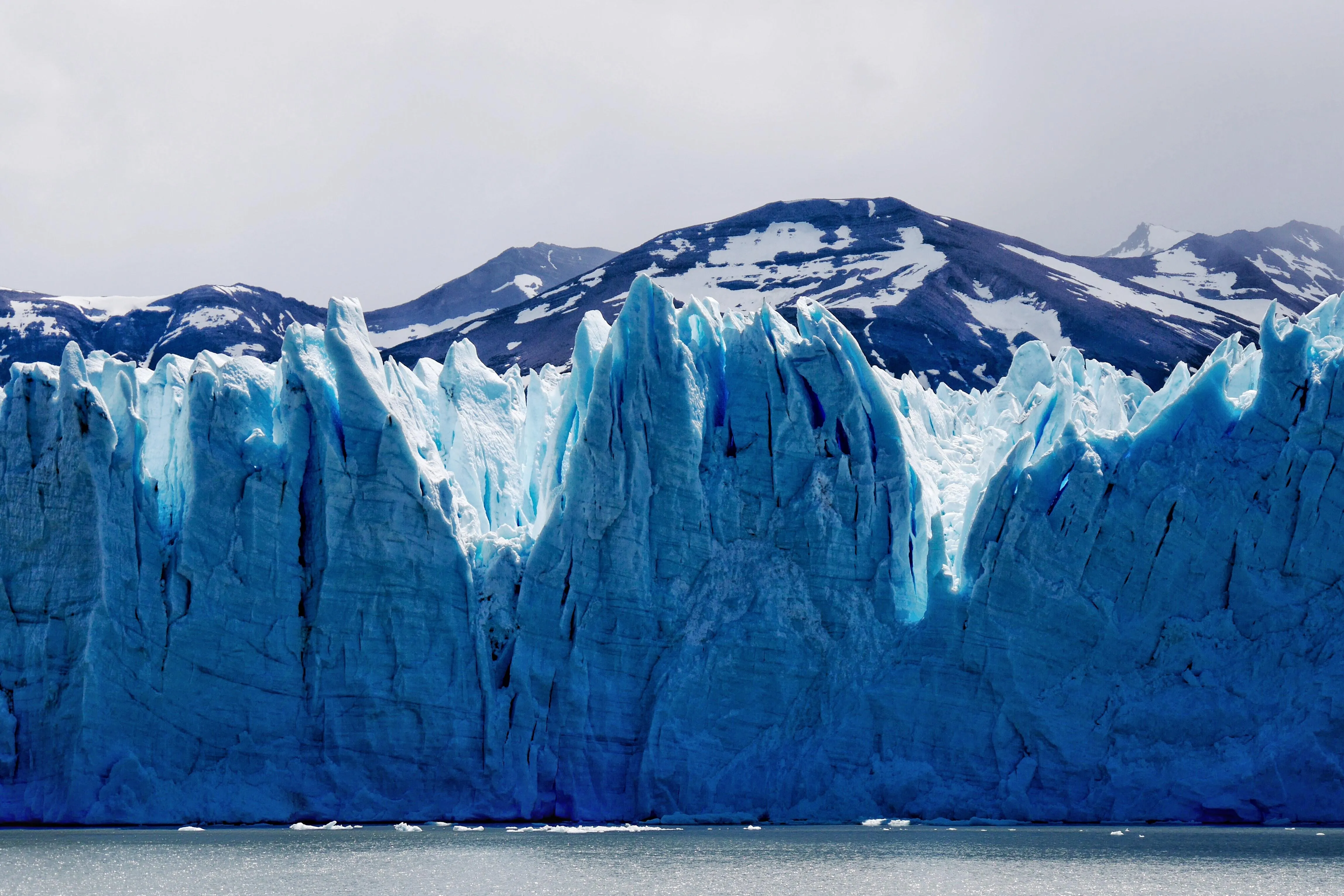 Large Glacier Ice Formation Against Blue Sky Wallpaper