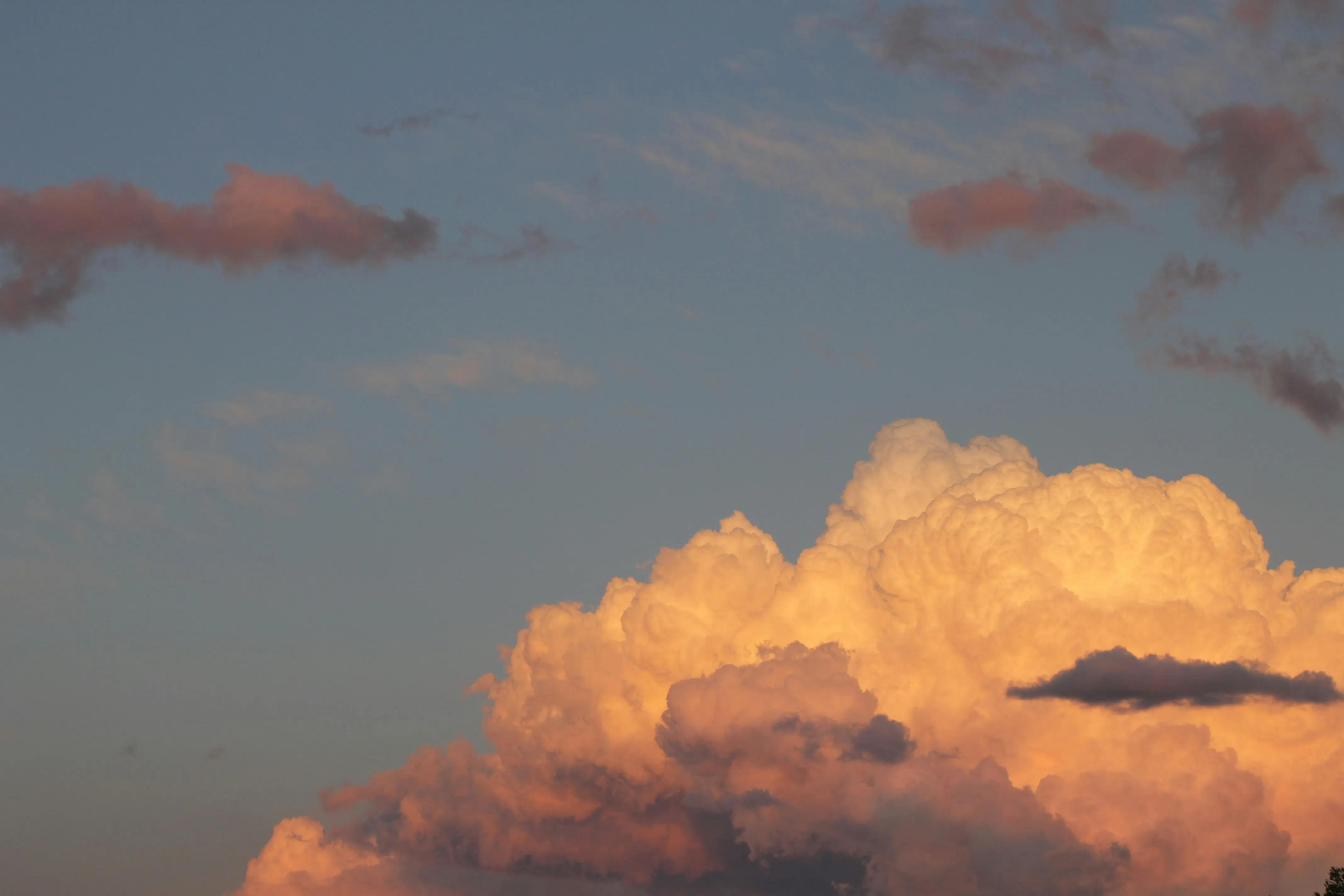 Large Orange Clouds Floating in the Late Evening Sky