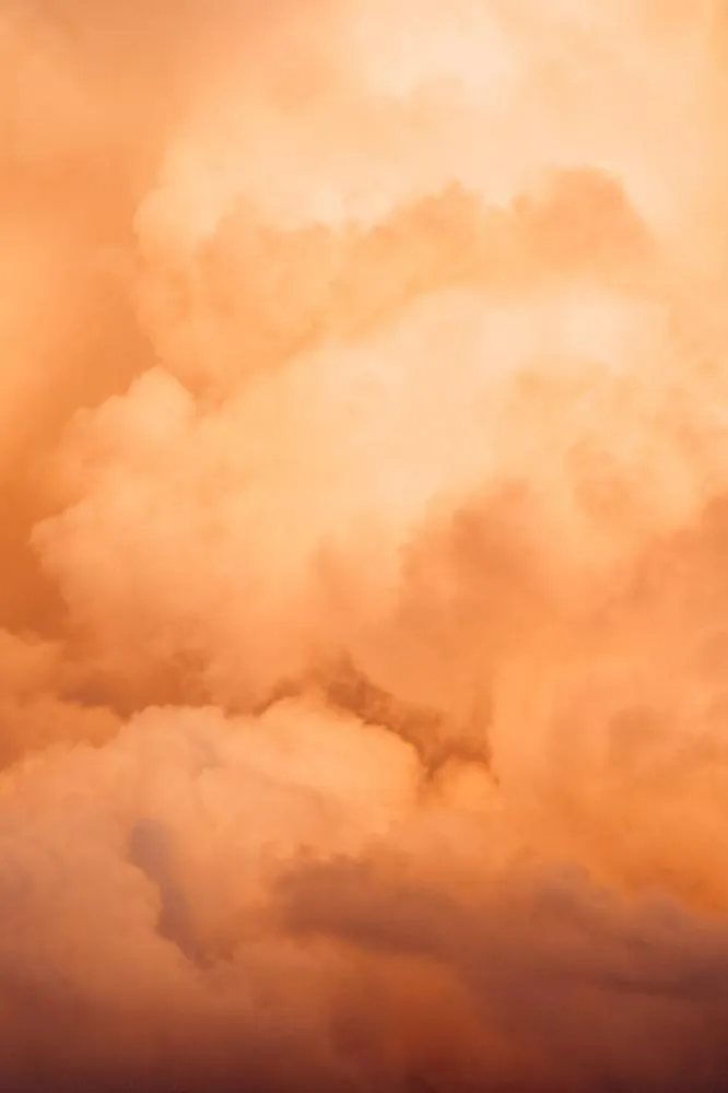 Large Orange Clouds Illuminated By Sunset Light Wallpaper