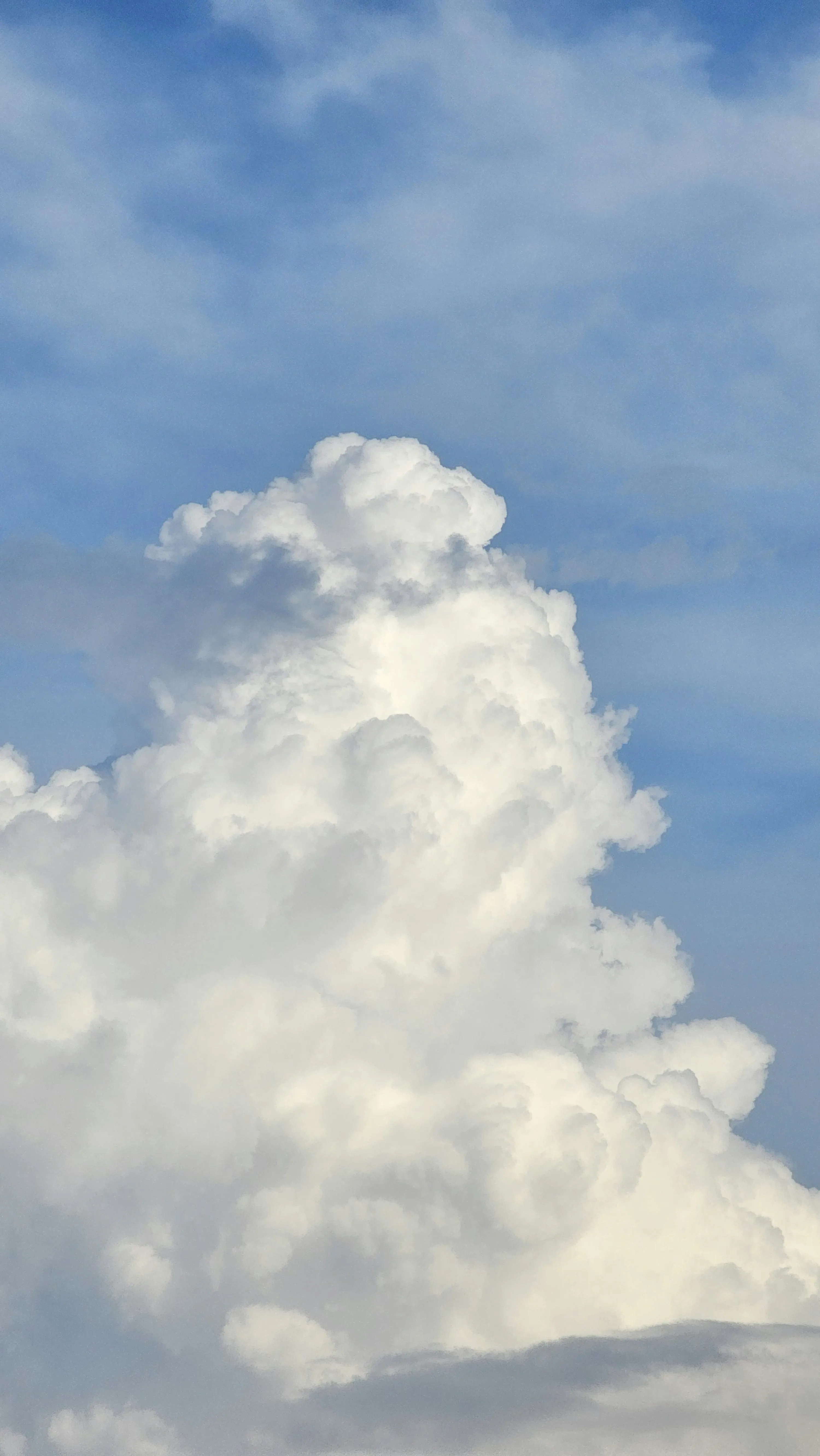 Large Puffy White Clouds Against Bright Blue Sky Image