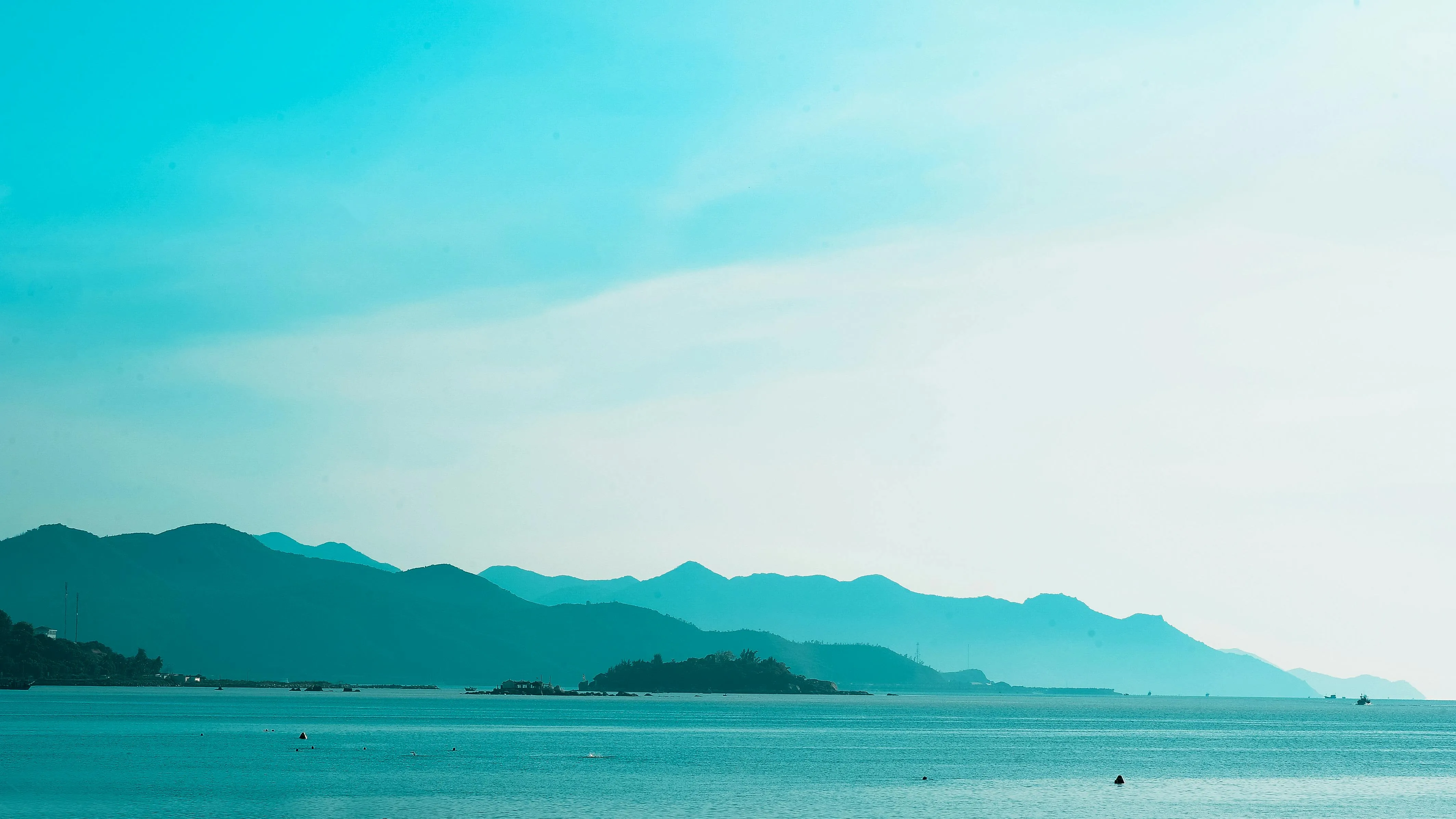 Light Blue Sky with Hazy Horizon Over the Ocean Wallpaper