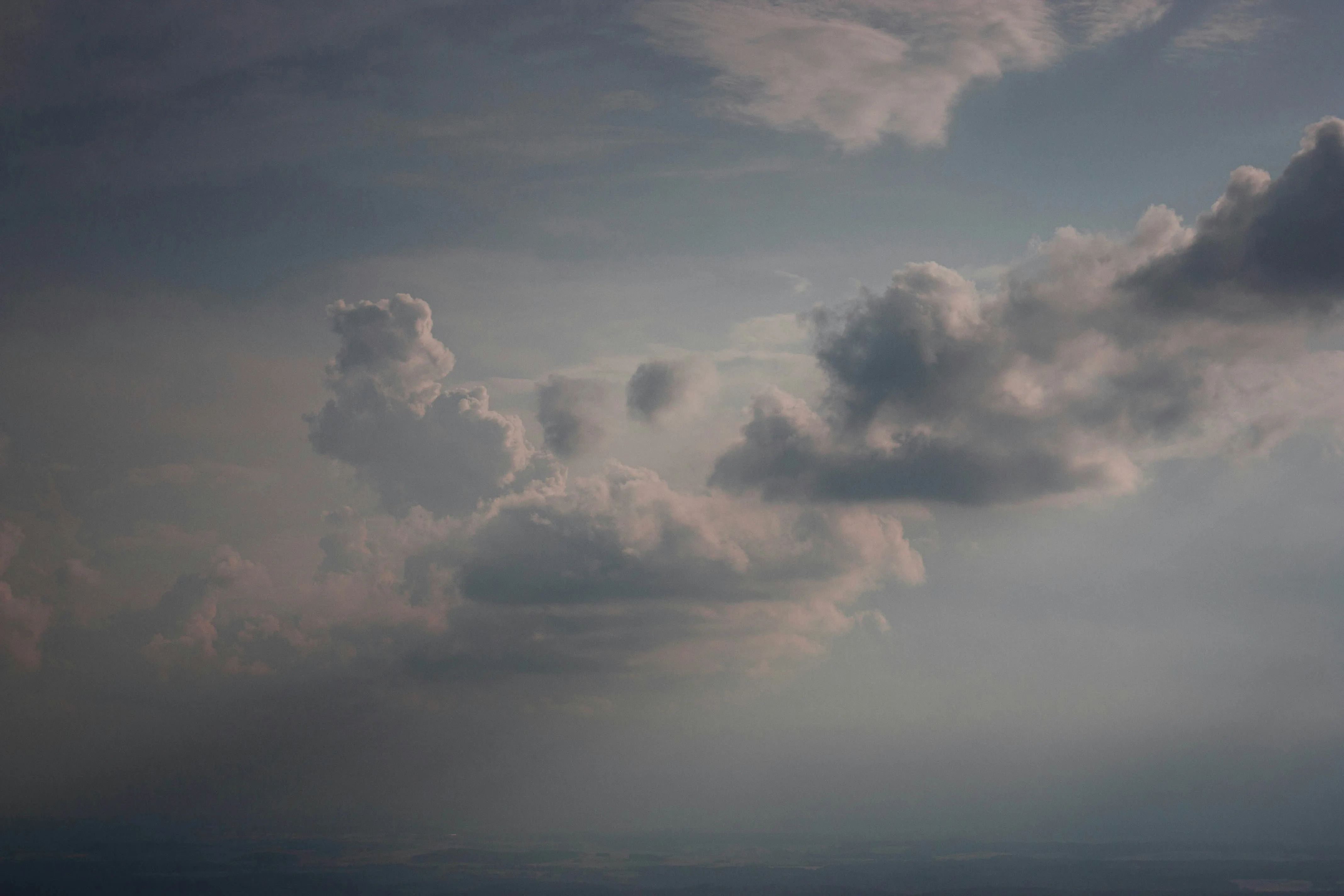 Light Clouds Scattered Over a Vast Blue Sky Wallpaper