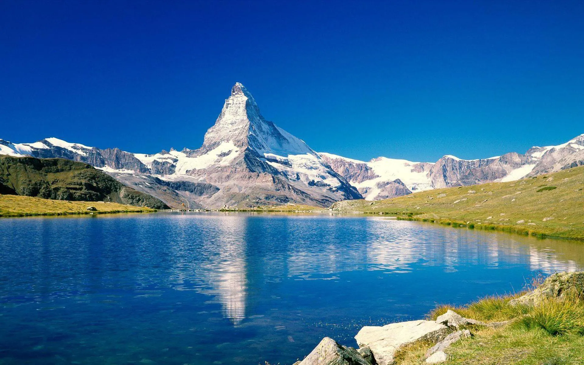 Majestic Mountain Reflected in Crystal Blue Lake Waters
