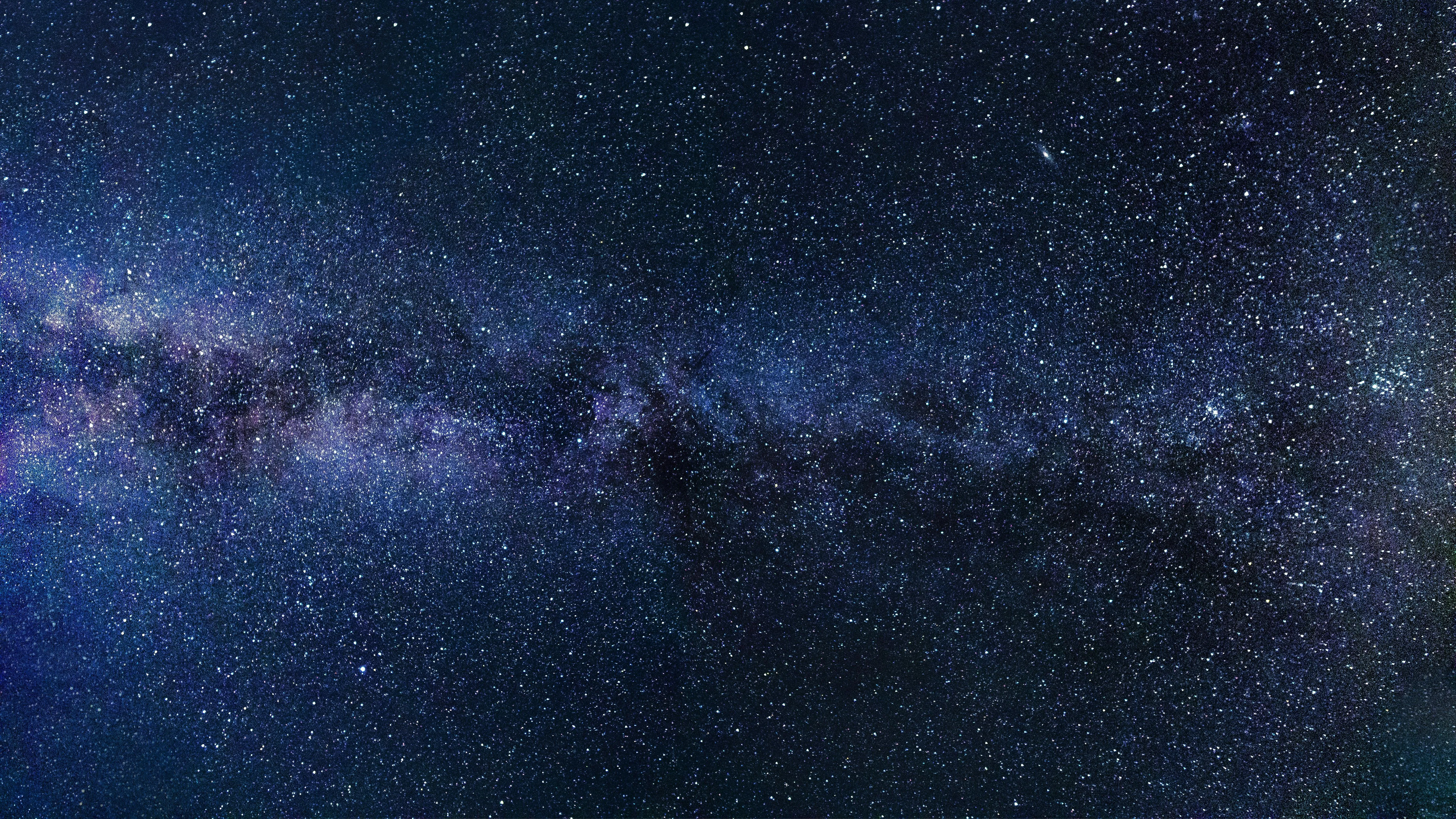 Majestic Starry Night with Cloud Layers Across Sky Image