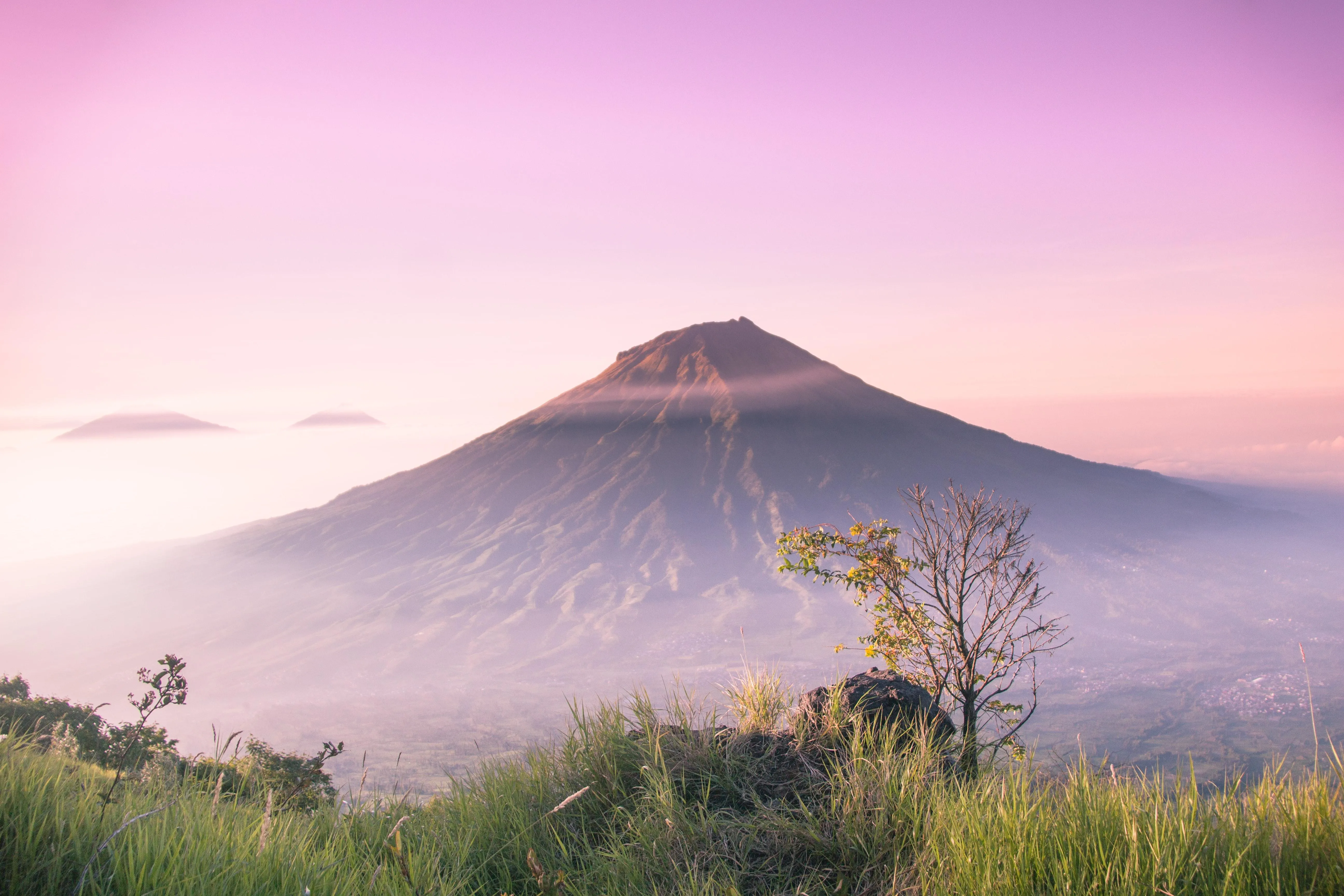 Majestic volcano surrounded by morning mist HD image