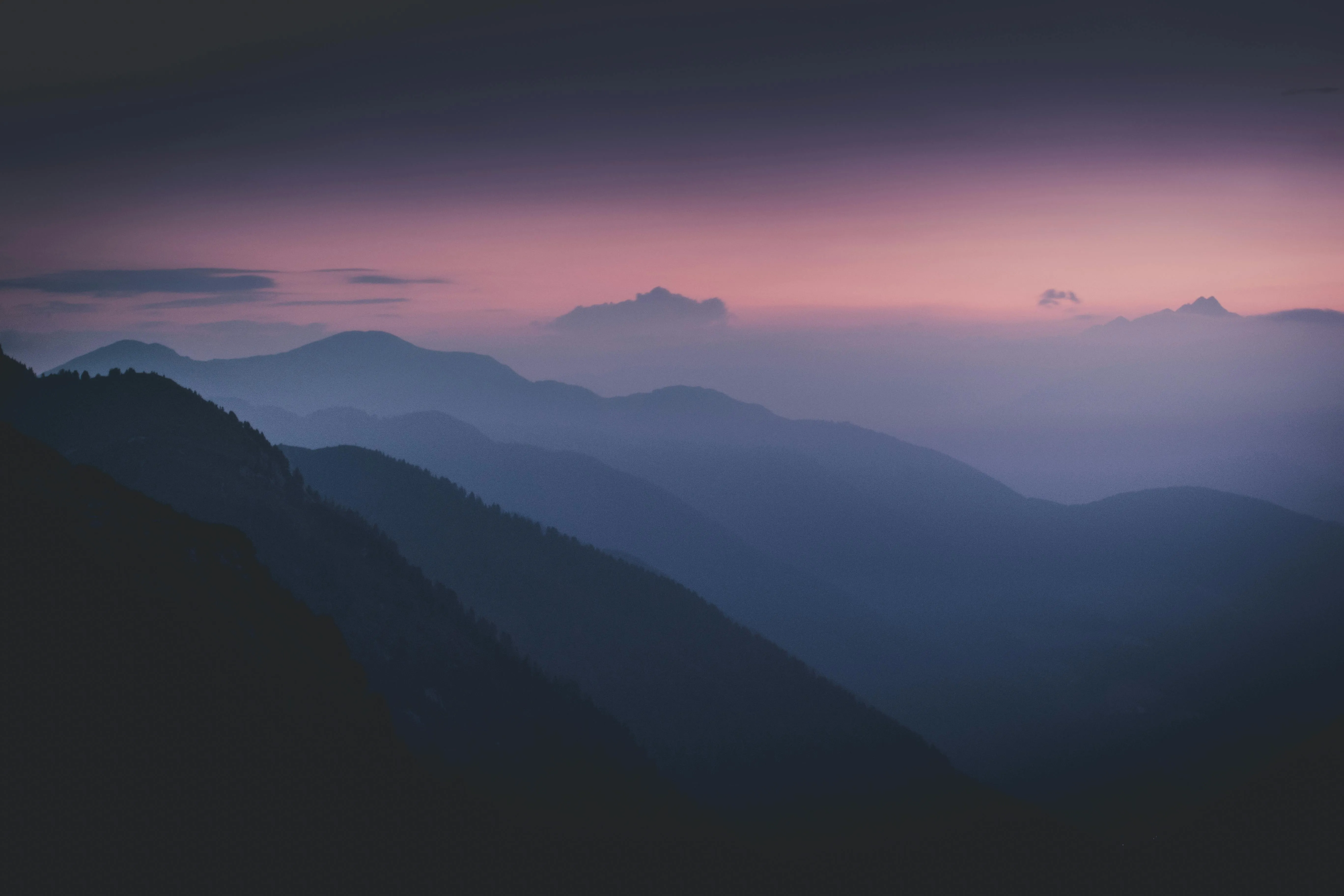 Misty Mountain Ridges Fading Into Purple Twilight Wallpaper