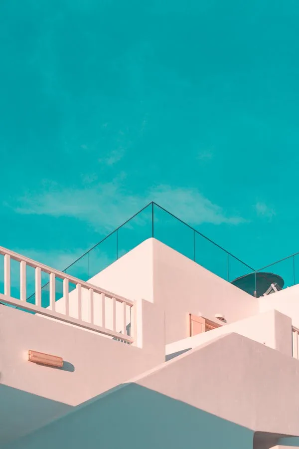 Modern Architecture Under a Teal and Clear Sky Wallpaper