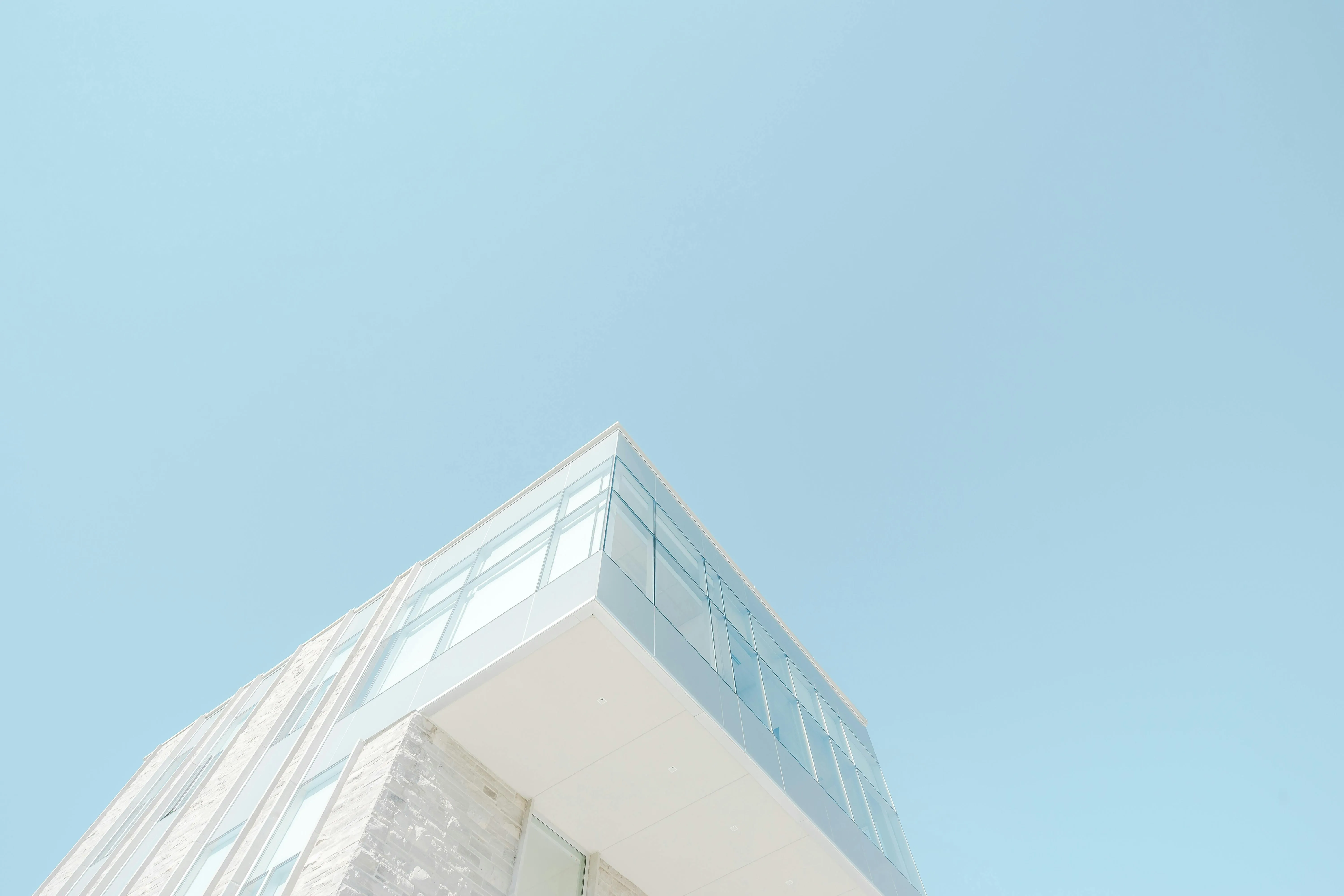 Modern Building with Sharp Edges Against Clear Sky Image