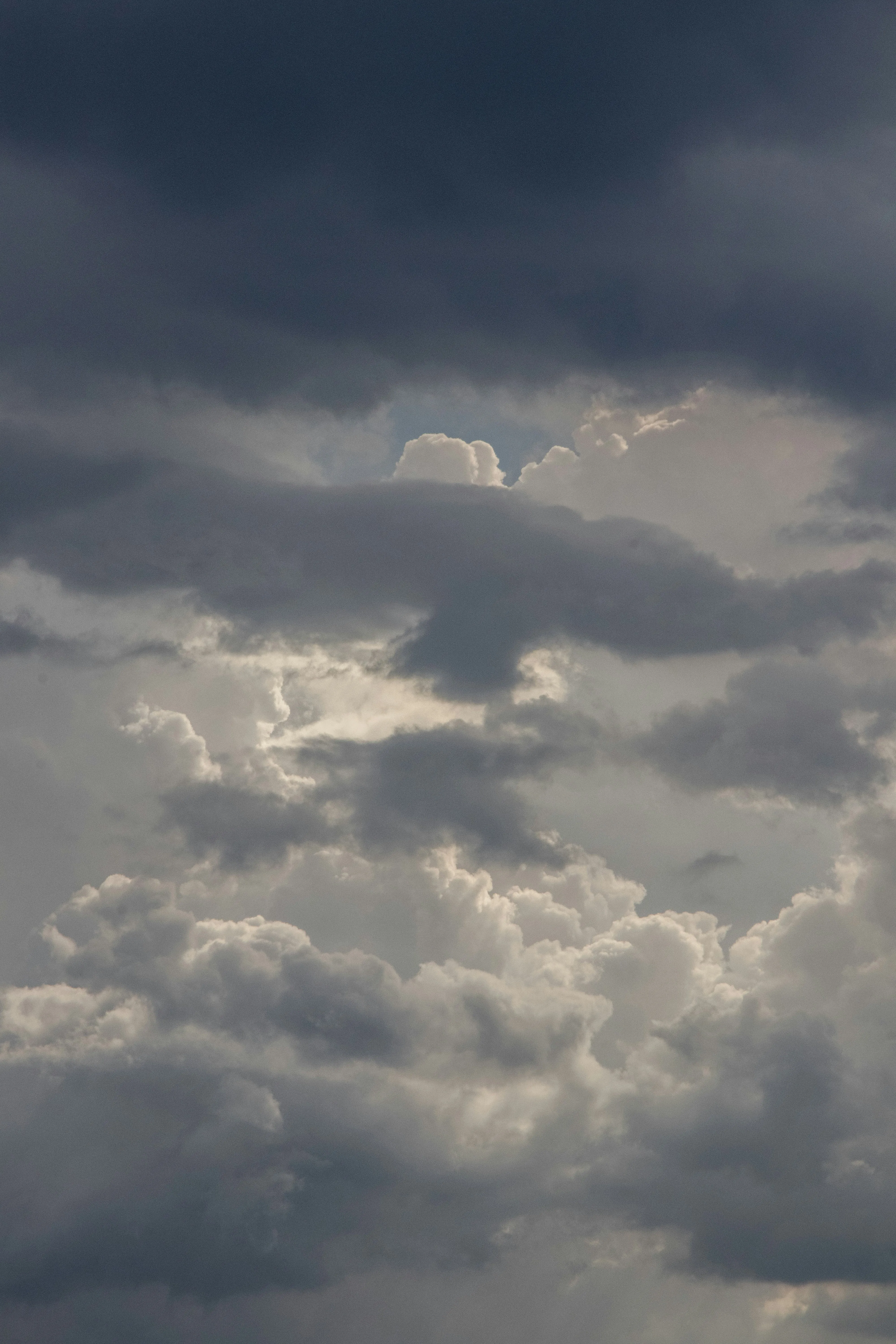 Moody Sky with Heavy Clouds and Diffused Sunlight Wallpaper